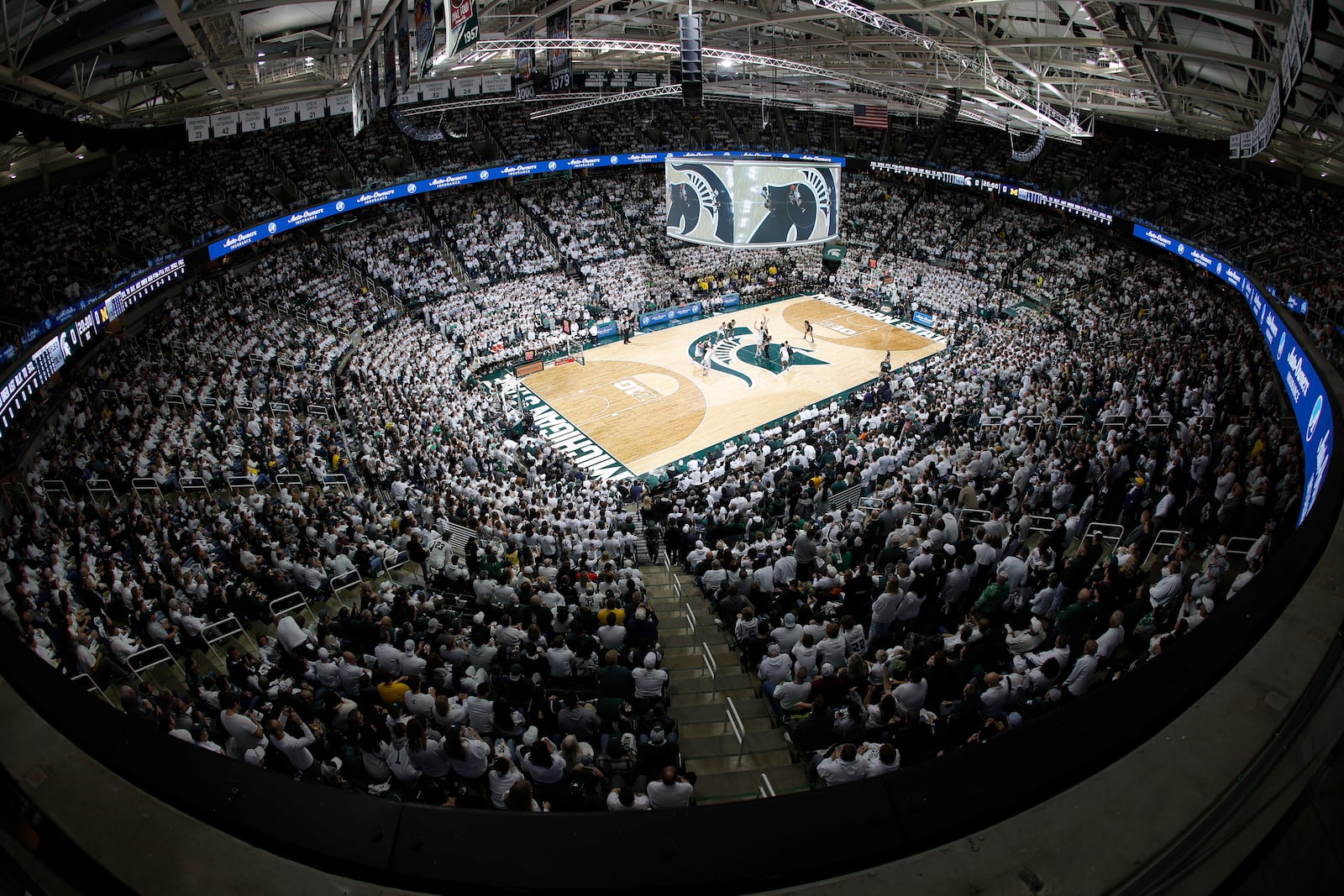 Michigan and Michigan State tip off their NCAA college basketball game, Sunday, March 9, 2025, in East Lansing, Mich. (AP Photo/Al Goldis)