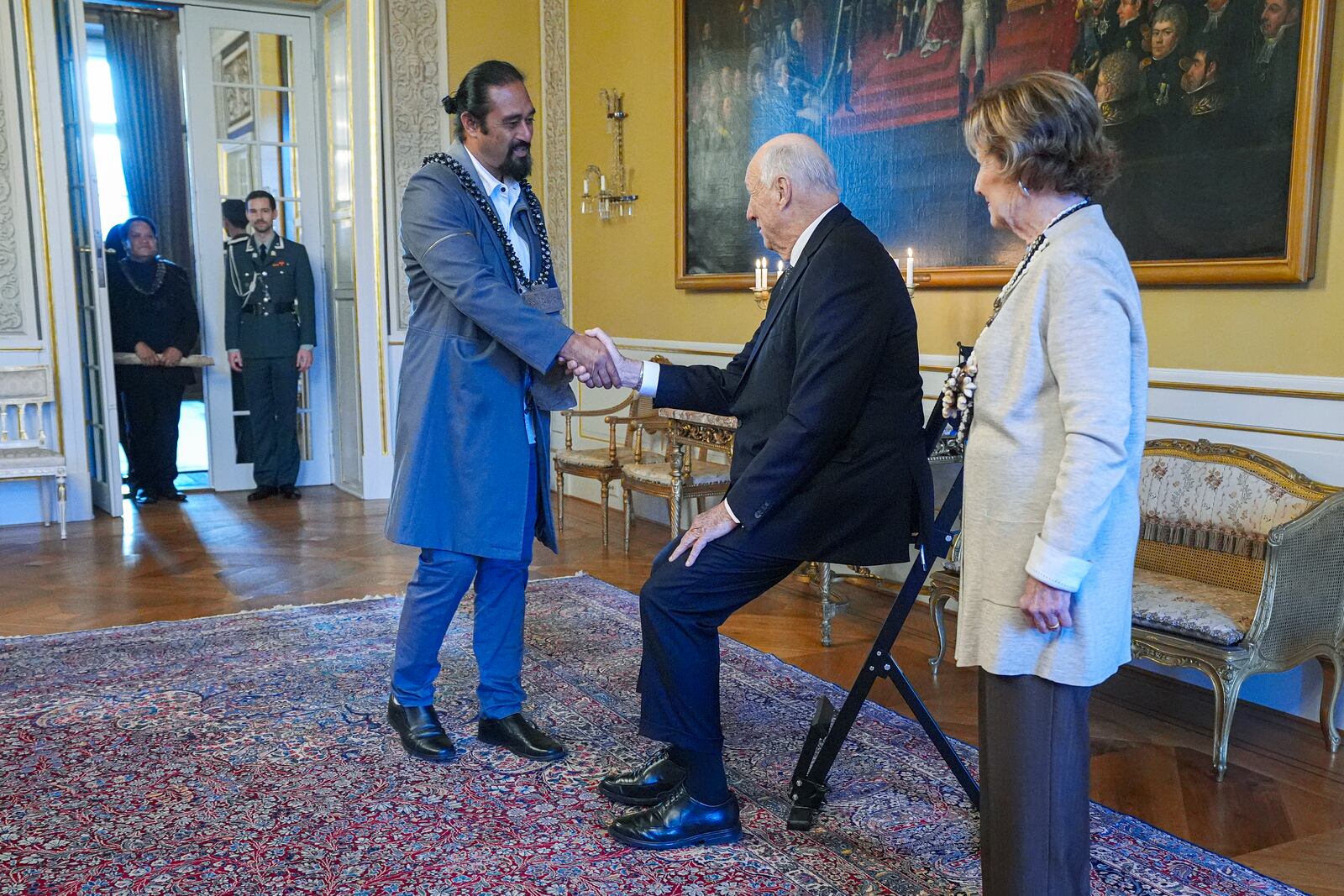 Norway's King Harald, centre, and Queen Sonja, right, welcome Miguel Pate Haoa, at the Royal Palace, in Oslo, Norway, Tuesday, Nov. 12, 2024. (Lise Aaserud/NTB Scanpix via AP)