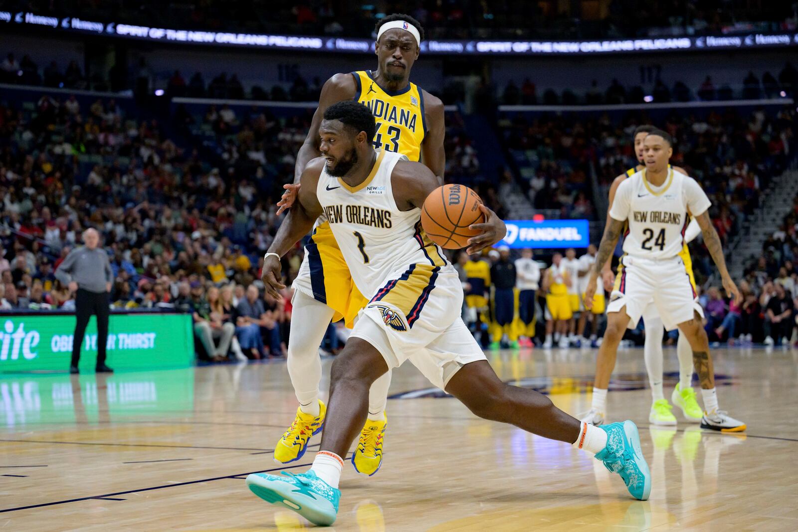 New Orleans Pelicans forward Zion Williamson (1) dribbles around Indiana Pacers forward Pascal Siakam (43) during the second half of an NBA basketball game in New Orleans, Friday, Nov. 1, 2024. (AP Photo/Matthew Hinton)