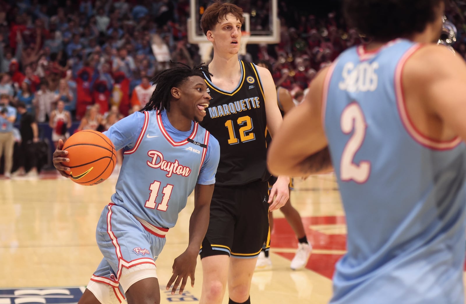 Dayton's Malachi Smith celebrates in the final seconds of a victory against Marquette on Saturday, Dec. 14, 2024, at UD Arena. David Jablonski/Staff