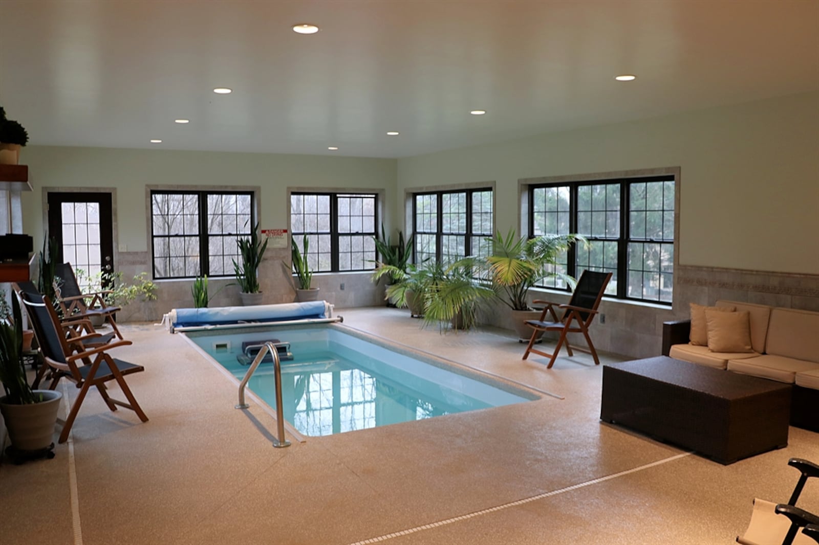 The 3.72-acre property includes a separate pool house with an in-ground, ozone-cleaned lap pool.