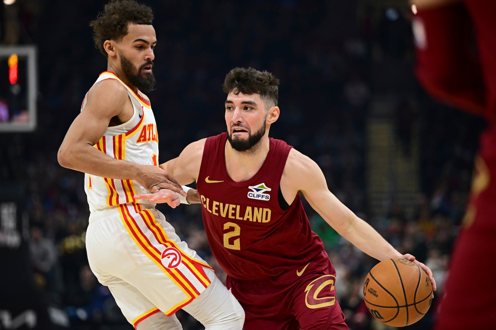 Cleveland Cavaliers guard Ty Jerome (2) drives against Atlanta Hawks guard Trae Young, left, in the first half of an NBA basketball game, Thursday, Jan. 30, 2025, in Cleveland. (AP Photo/David Dermer)