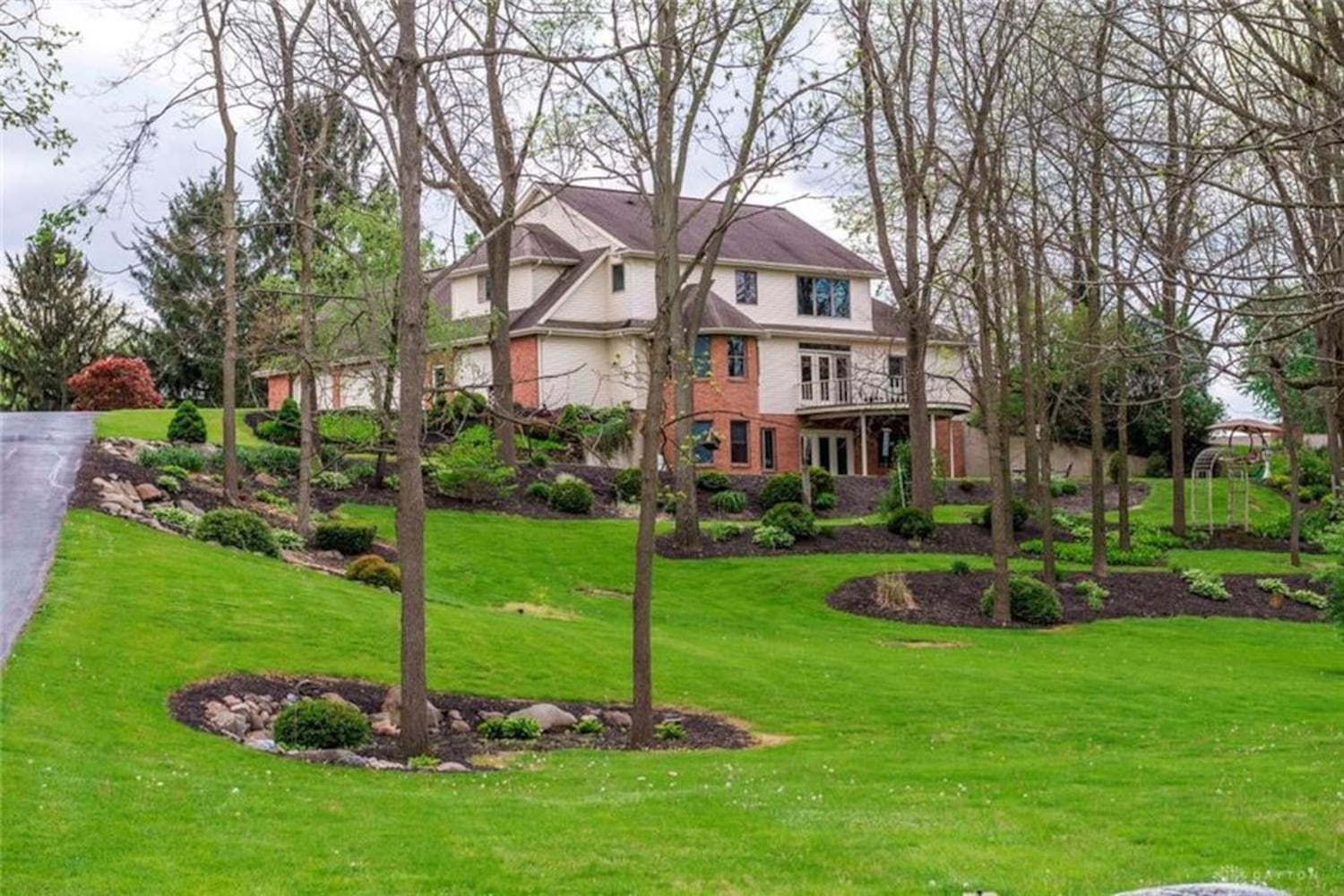 PHOTOS: Nearly 10-acre Miami County property listed has luxury home, stocked fishing pond