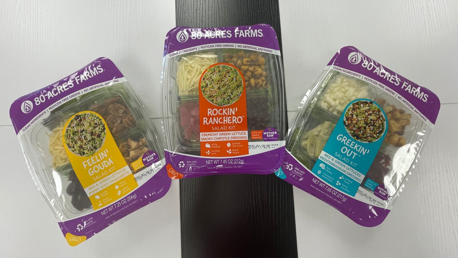 Pictured are the new salad kits, marketed as “grab-and-go meals,” from 80 Acres Farms that will be available in Kroger stores across the region. MICHAEL D. PITMAN/STAFF