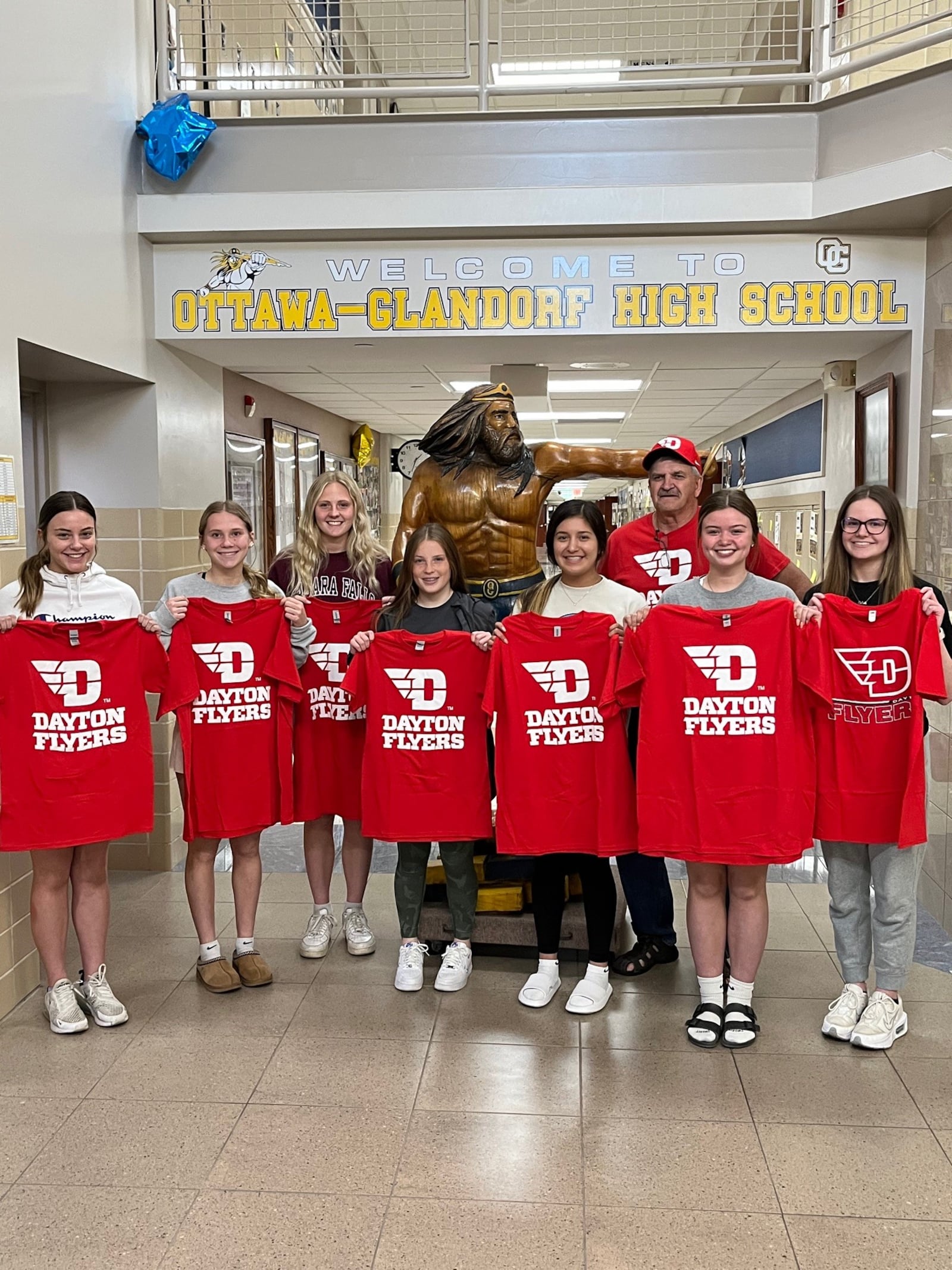 The Ottawa Glandorf students back at their Putnam County school with the Dayton Flyers t-shirts given them by UD Arena usher Ricard Keehn ( pictured in the back) (Contributed Photo)