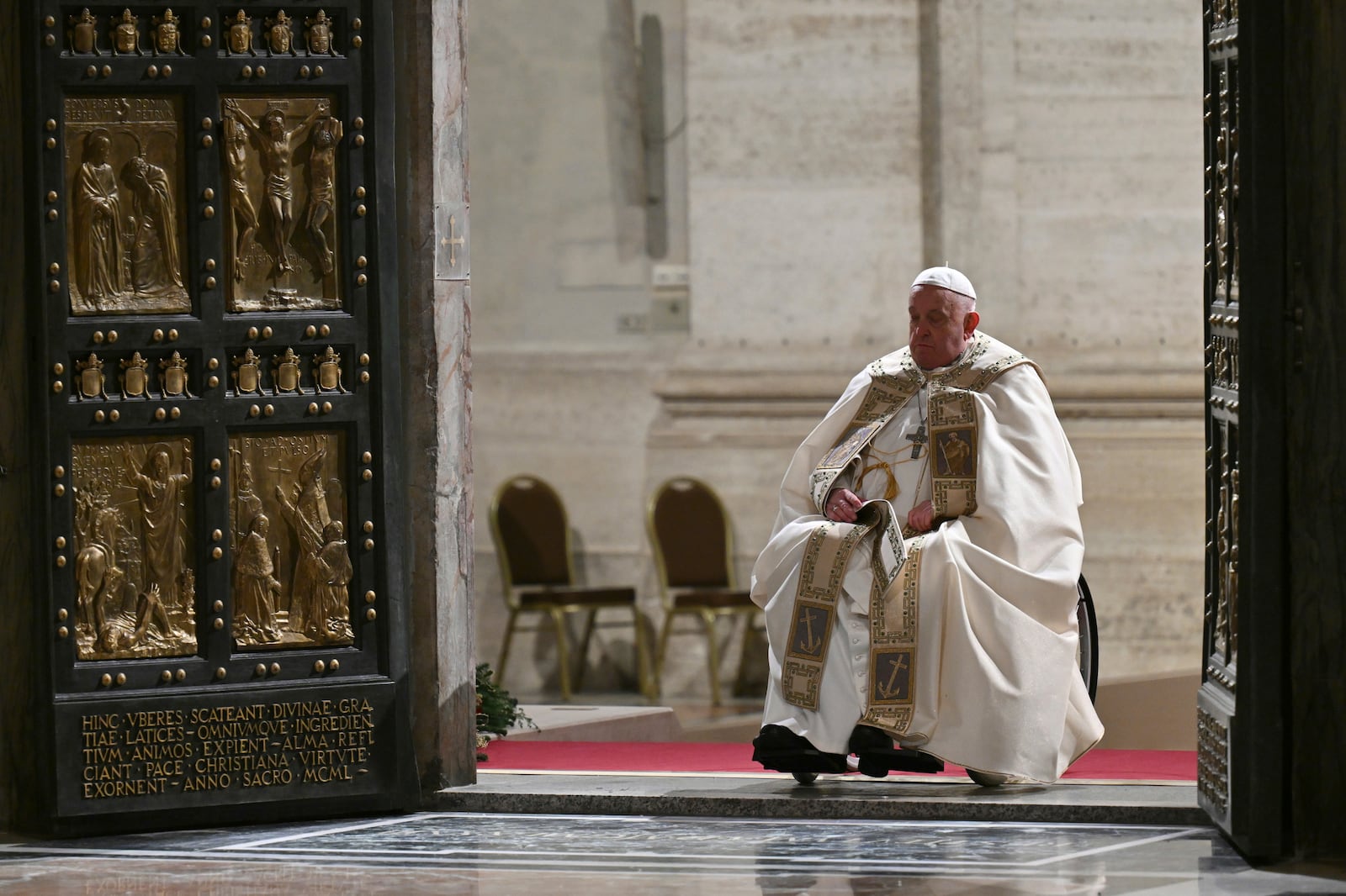 Pope Francis opens the Holy Door of St Peter's Basilica to mark the start of the Catholic Jubilee Year, at the Vatican, Dec. 24, 2024. (Alberto Pizzoli/Pool Photo via AP)