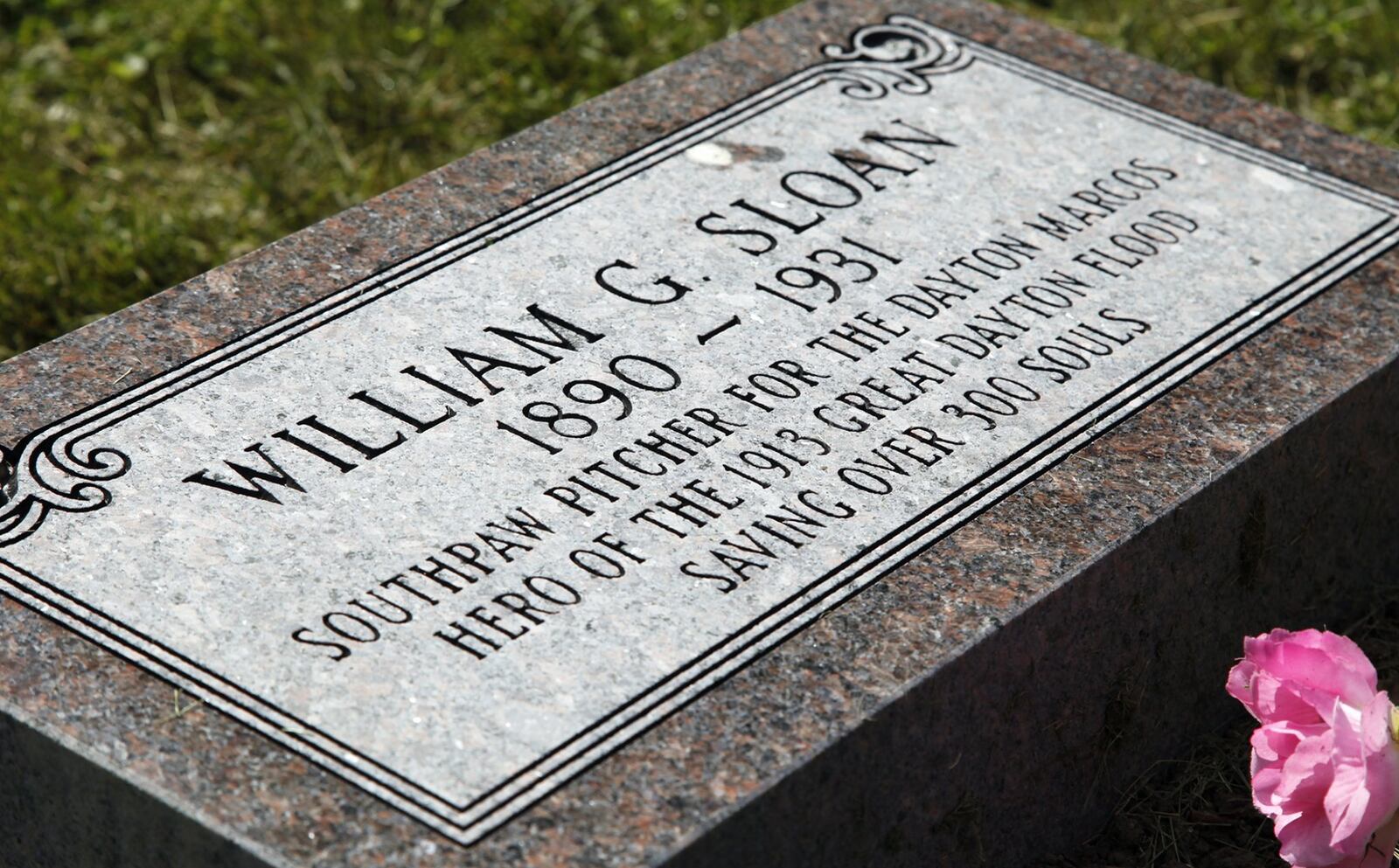 W.G. Sloan, pitcher for the Dayton Marcos of the Negro Leagues and one of the heroes of the 1913 Flood — he saved over 300 lives — had been buried in an unmarked grave at Woodland Cemetery for 82 years. A man from Troy paid for a gravestone commemorating Sloan that was put in place late Thursday. TY GREENLEES / STAFF