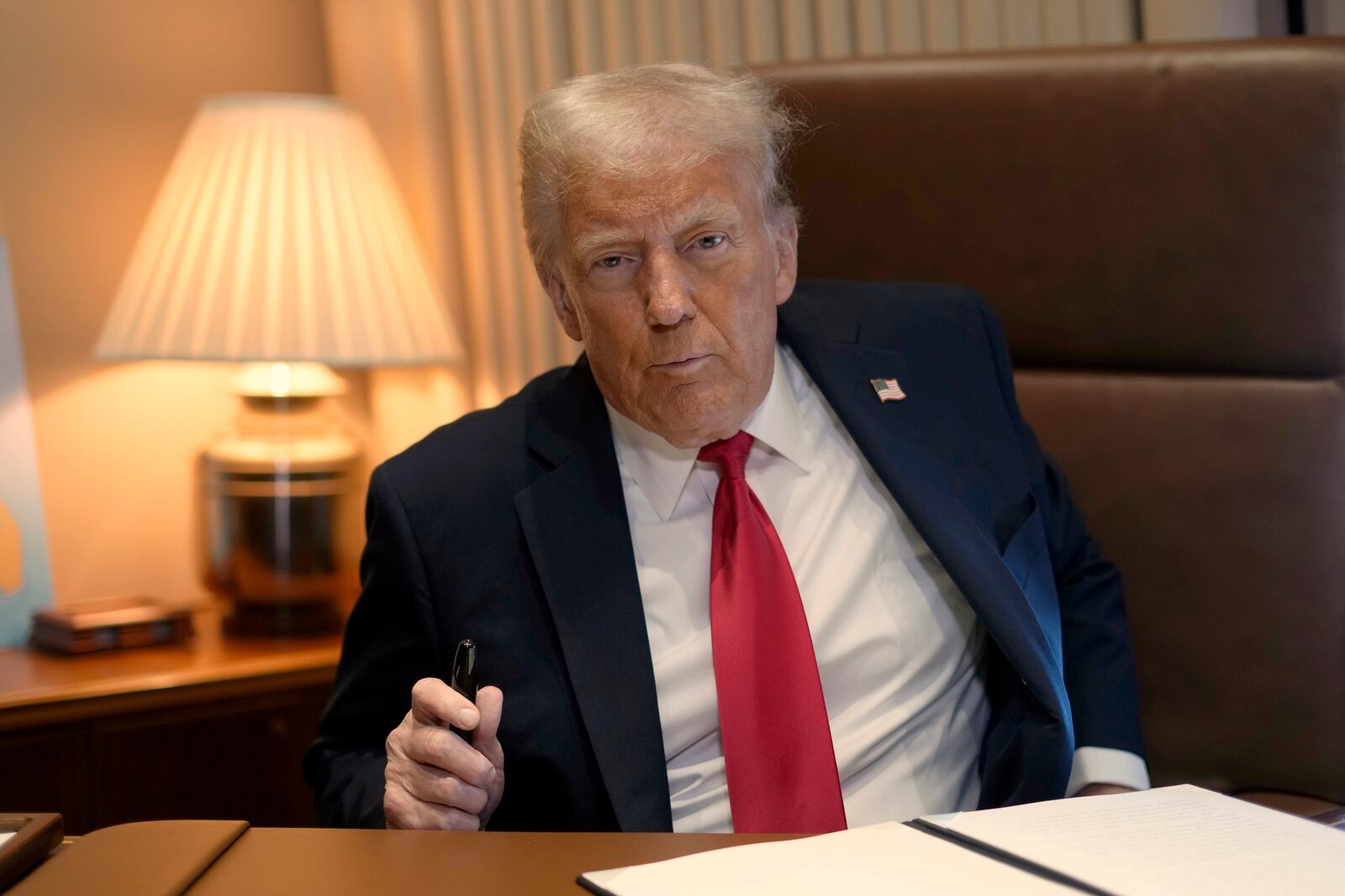 President Donald Trump speaks to reporters aboard Air Force One where he signed a proclamation declaring Feb. 9 Gulf of America Day as he travels from West Palm Beach, Fla. to New Orleans, Sunday, Feb. 9, 2025. (AP Photo/Ben Curtis)