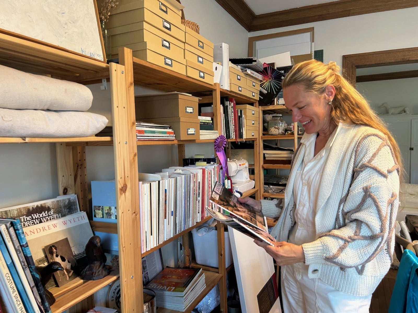 Megan Smith stands in in her home office with magazines she has edited. “I started being really scrappy and entrepreneurial while having babies at home. I started a blog called The Art of Homemaking, and the world of writing opened up to me.”