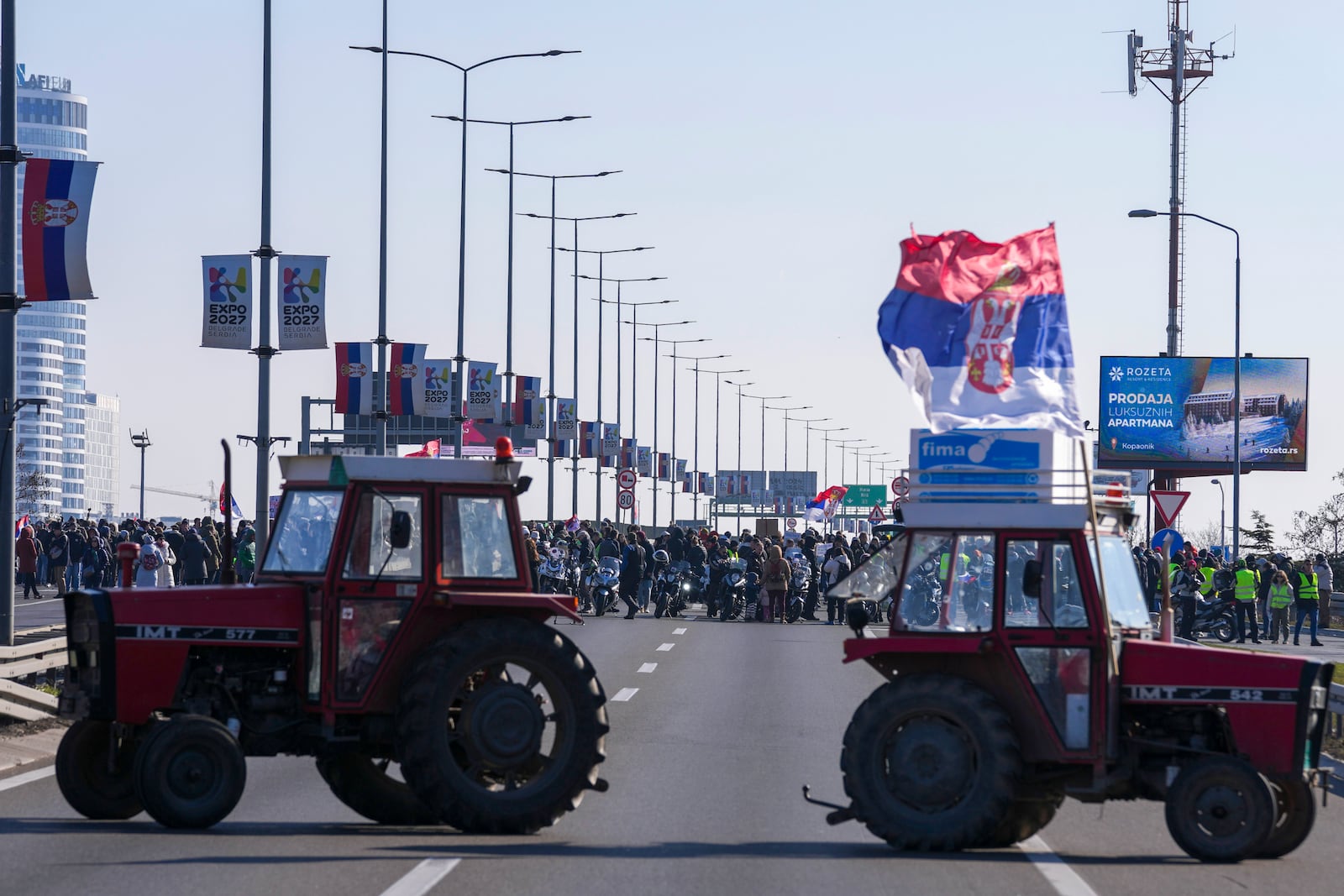 People participate in a 7-hour long blockade of a highway in Belgrade, Serbia, Sunday, Feb. 9, 2025, to protest the Nov. 1. collapse of a concrete canopy at the central train station in Novi Sad, that killed 15 people. (AP Photo/Darko Vojinovic)