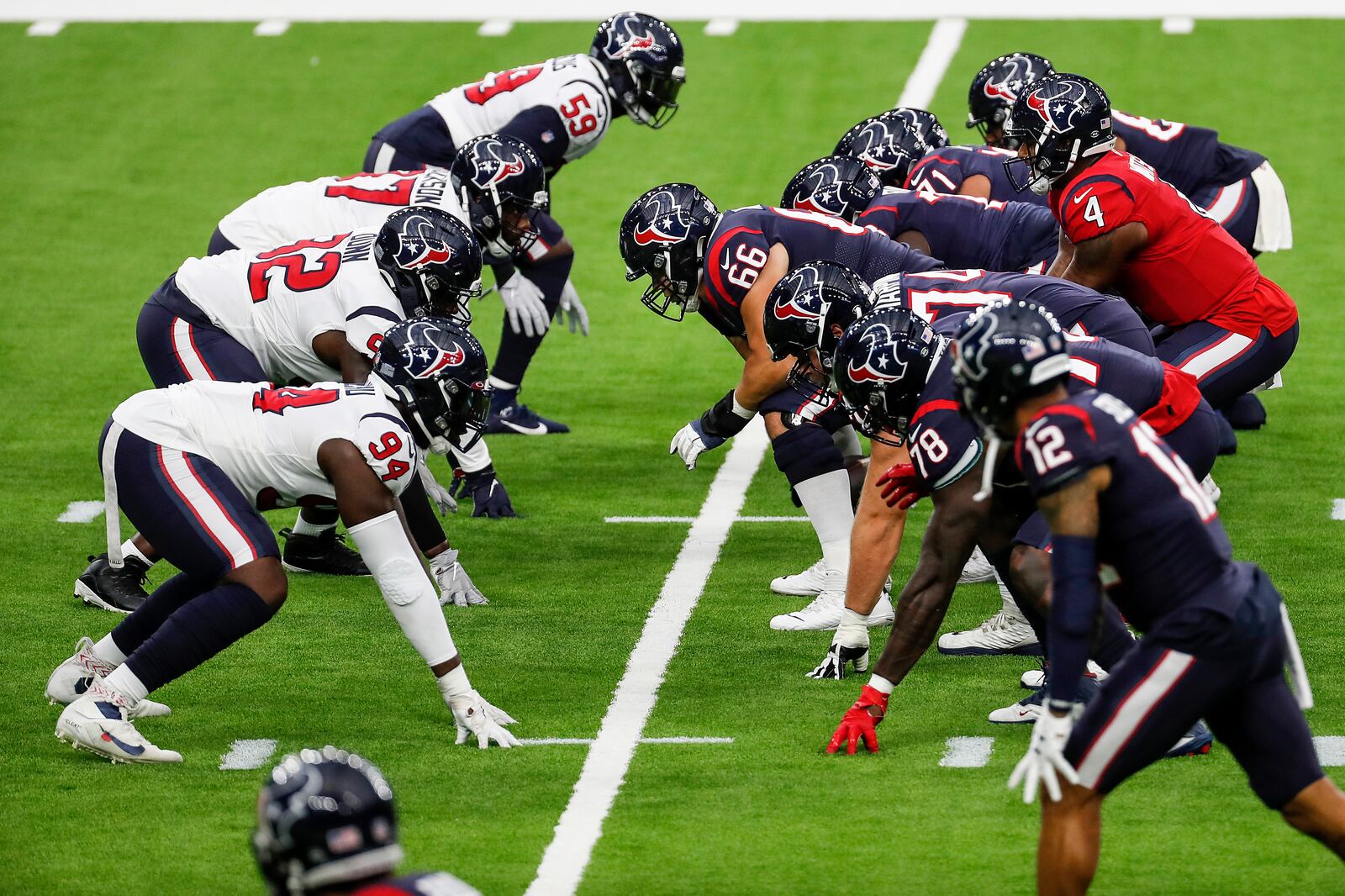 Houston Texans quarterback Deshaun Watson (4) takes a snap from center Nick Martin (66) during NFL football training camp Thursday, Aug. 27, 2020, in Houston. (Brett Coomer/Houston Chronicle via AP, Pool)