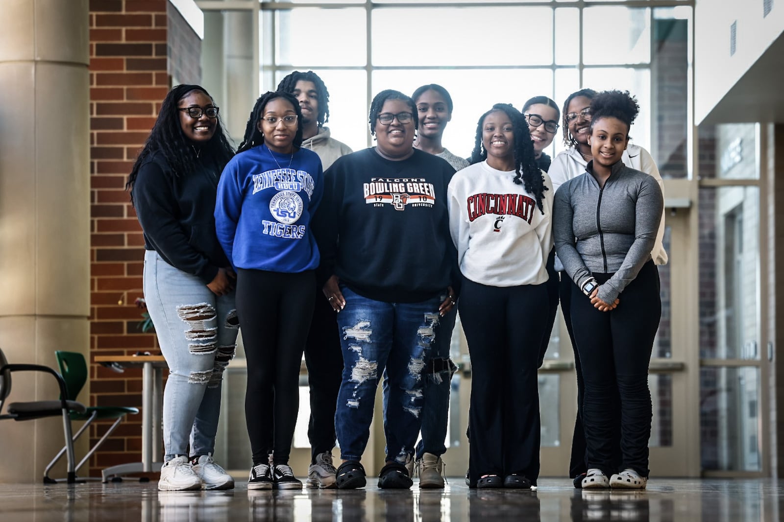 The Northmont Black Student Association put together an art exhibit showcasing Black history, which was put on display this month. The art hangs in entrance hall of the school. Students, left to right, back row: Trinity Ancrum, Noah McClure, Sydney Wilson, Jalyn Cummings, and Devin Chivers. Left to right, front row: Amari Bumpus, Kyla Ward, Paris Coogler and Kennedi Robinson. JIM NOELKER/STAFF