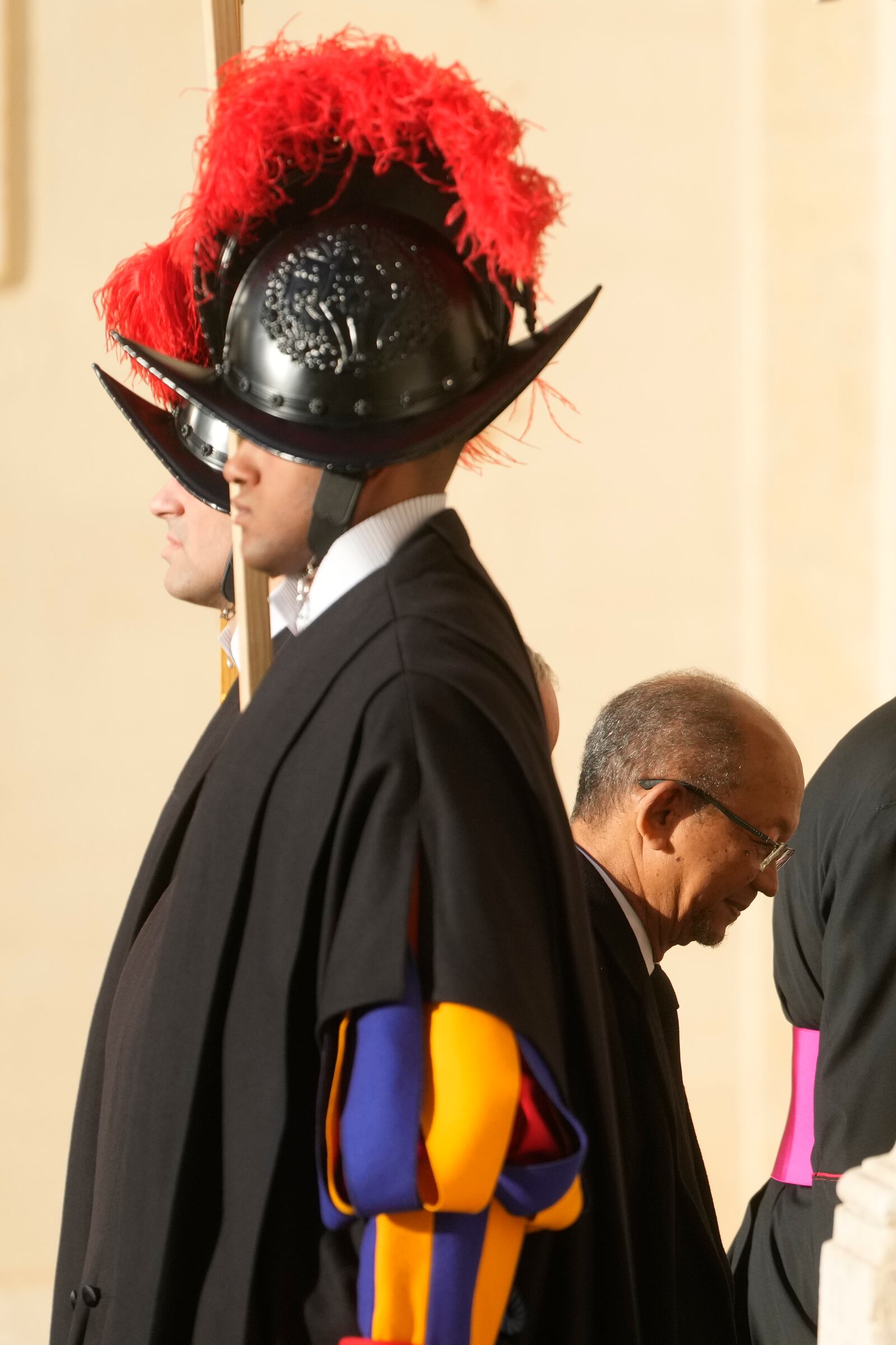 Haiti's President Leslie Voltaire walks past Vatican Swiss guards ahead of his meeting with Pope Francis at the Vatican, Saturday, Jan. 25, 2025. (AP Photo/Gregorio Borgia)