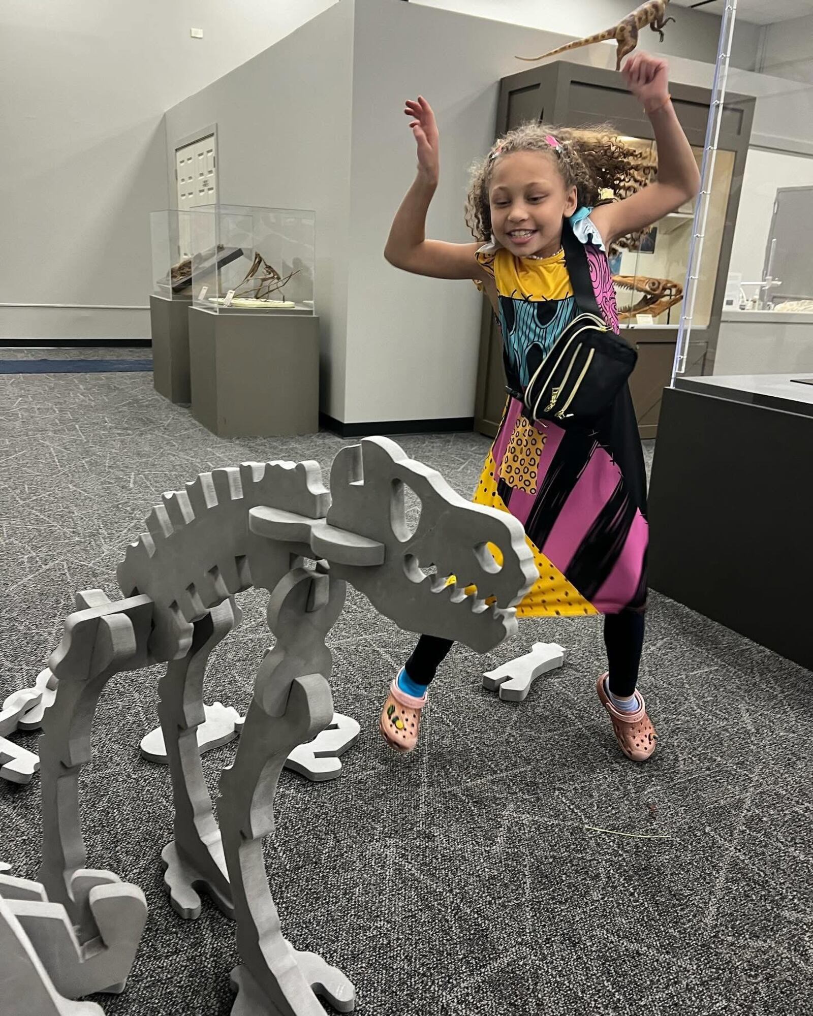 Pamela Chandler's daughter Jasmine enjoys a dinosaur exhibit at the Boonshoft Museum of Discovery. CONTRIBUTED