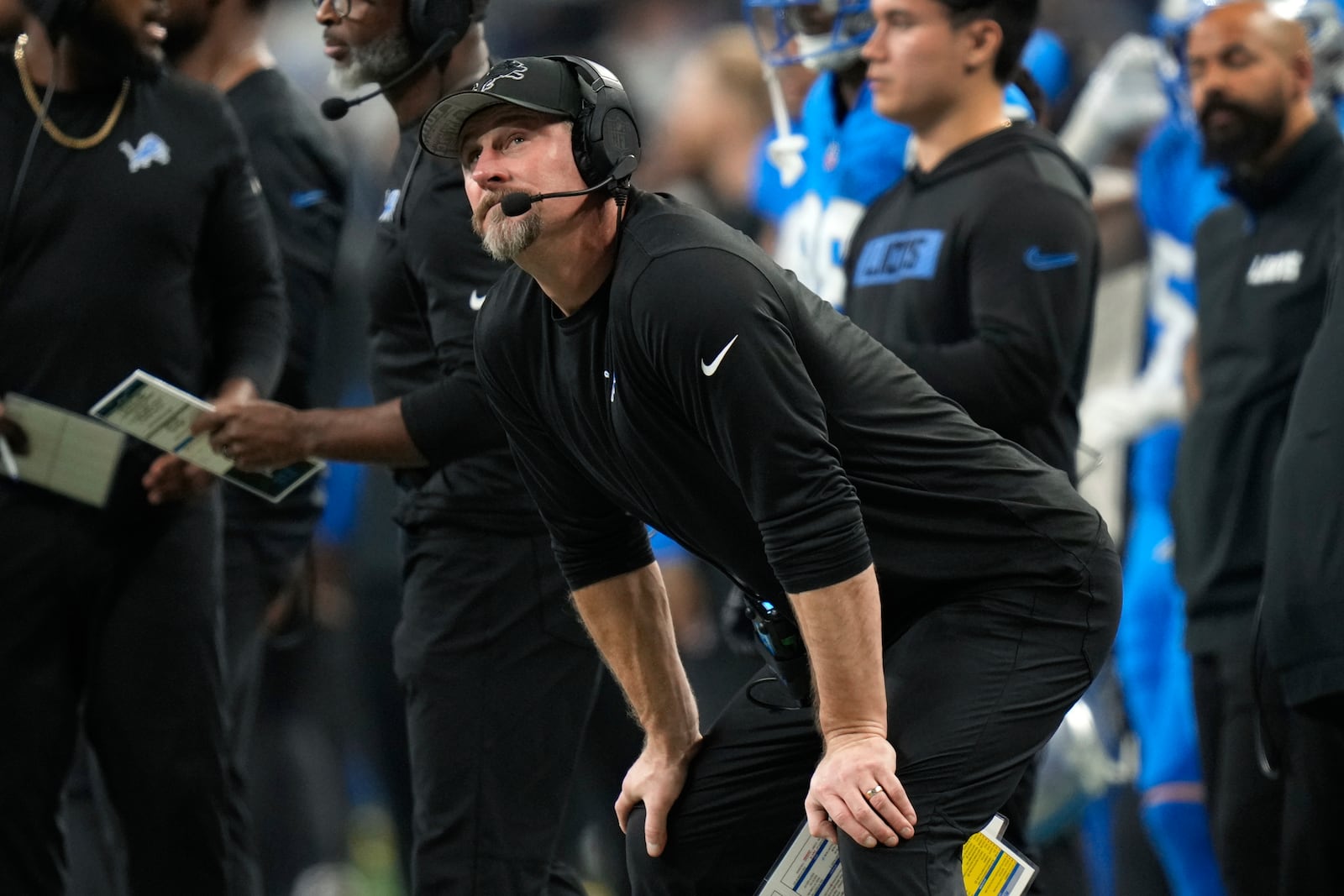 Detroit Lions head coach Dan Campbell watches against the Washington Commanders during the second half of an NFL football divisional playoff game, Saturday, Jan. 18, 2025, in Detroit. (AP Photo/Seth Wenig)