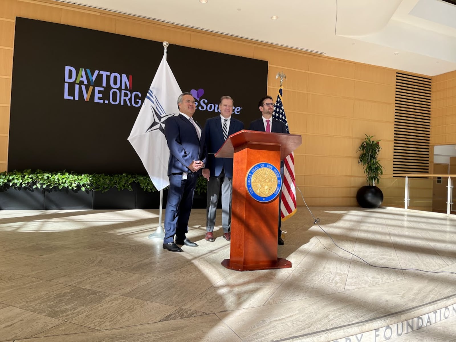 U.S. Rep. Mike Turner, R-Dayton, center, after discussing plans Wednesday for next May's expected NATO Spring Parliamentary Assembly visit to Dayton. On Turner's right: Erhardt Preitauer, president and CEO of CareSource. On his left, Gabriel van Aalst, president and CEO of Dayton Live. THOMAS GNAU/STAFF