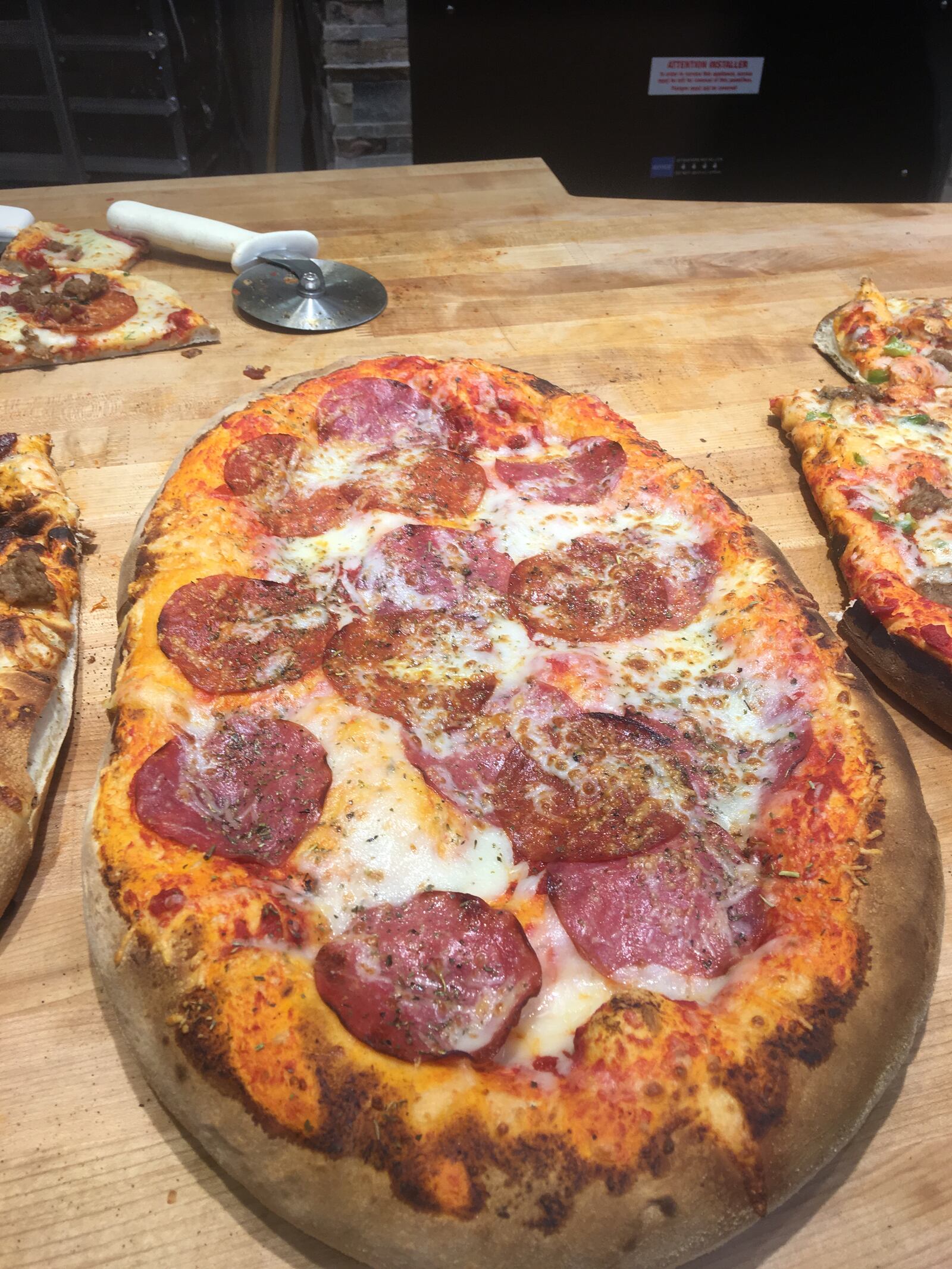 Customers can order ready-to-eat pizza at the Cornerstone of Centerville Kroger store. KARA DRISCOLL/STAFF