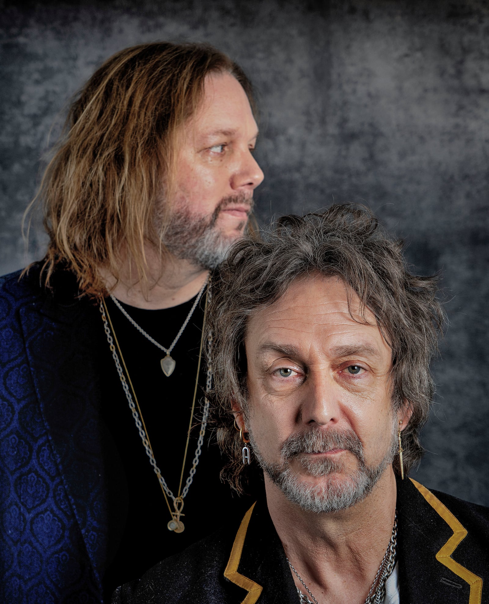 Rich Robinson, left, and his brother Chris Robinson of The Black Crowes pose for a portrait in Los Angeles on Monday, Dec. 9, 2024. (AP Photo/Richard Vogel)