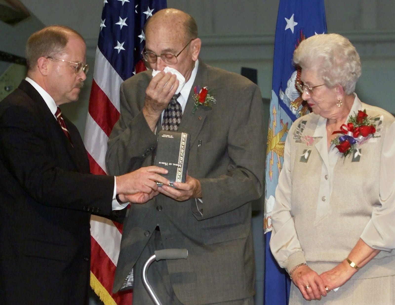 F. Whitten Peters, left, Secretary of the Air Force, presents the Medal of Honor to William and Irene Pitsenbarger during ceremonies at Wright Patterson Air Force Base in Dayton, Ohio, Friday, Dec. 8, 2000. The award was given posthumously to their son, Airman 1st Class William H. Pitsenbarger, a pararescueman killed in action during the Vietnam War. FILE PHOTO