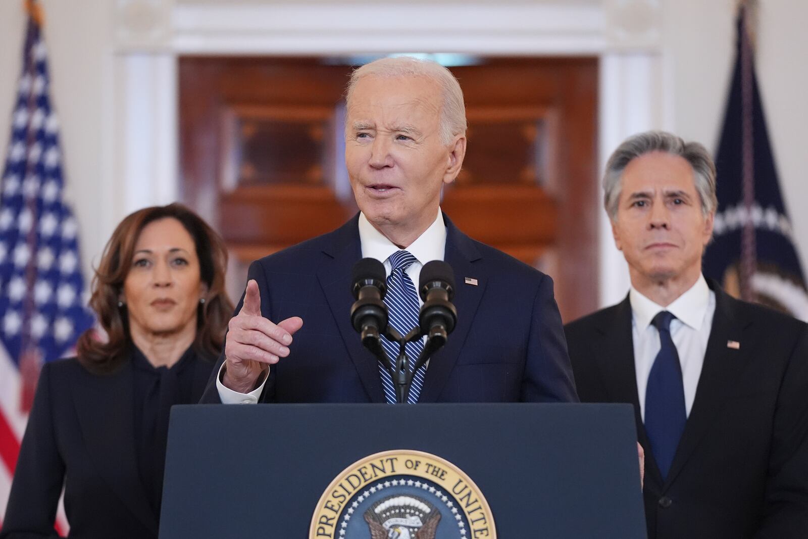 President Joe Biden, center, with Vice President Kamala Harris, left, and Sec. of State Anthony Blinken, right, speaks in the Cross Hall of the White House on the announcement of a ceasefire deal in Gaza and the release of dozens of hostages after more than 15 months of war, Wednesday, Jan. 15, 2025, in Washington. (AP Photo/Evan Vucci)