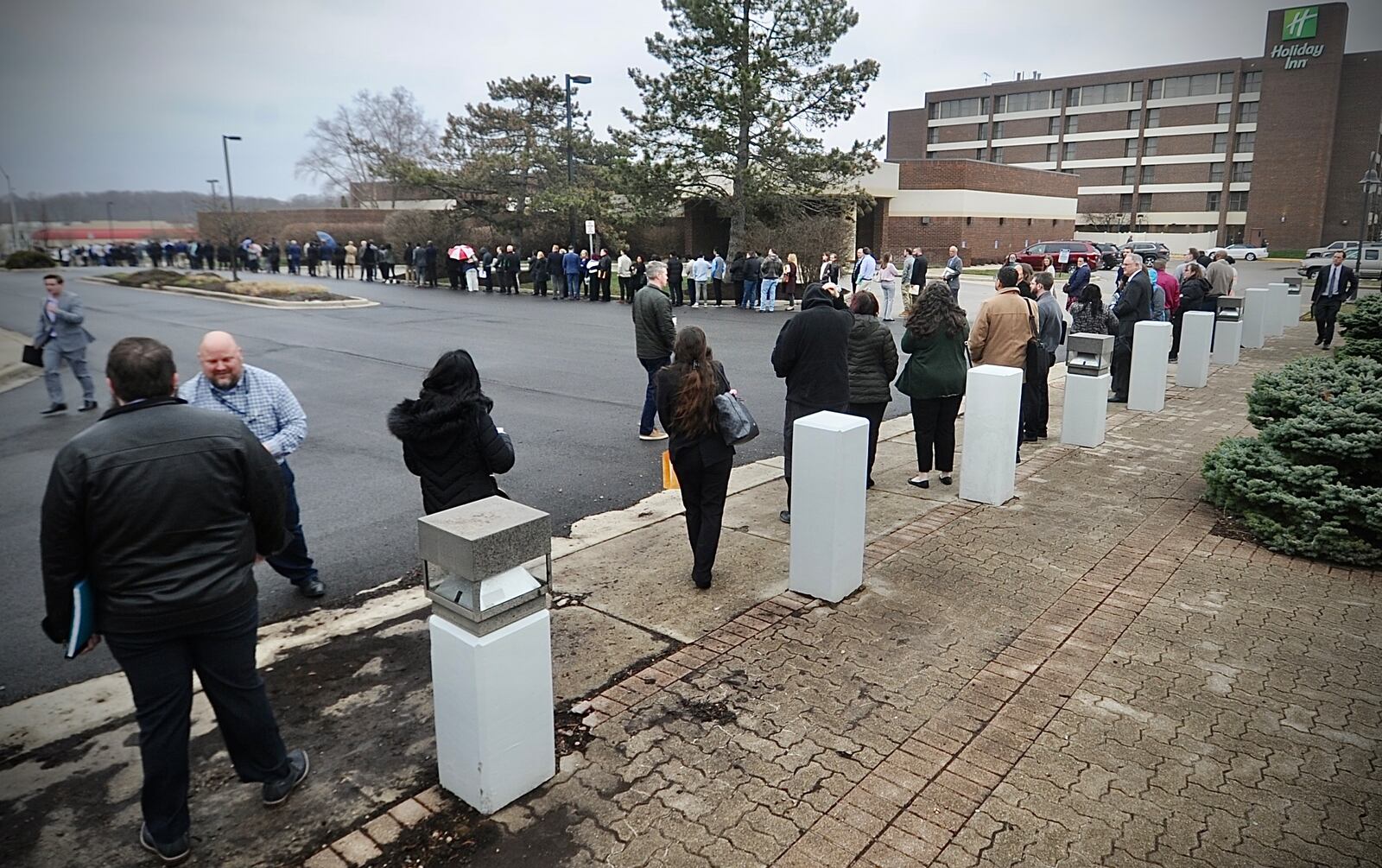 Jobseekers line up outside the Holiday Inn in Fairborn on Wednesday, March 22, 2023, for the one-day Air Force Life Cycle Management Center hiring event. AFLCMC is based at Wright-Patterson Air Force Base, home to some 35,000 military and civilian employees. MARSHALL GORBY \STAFF