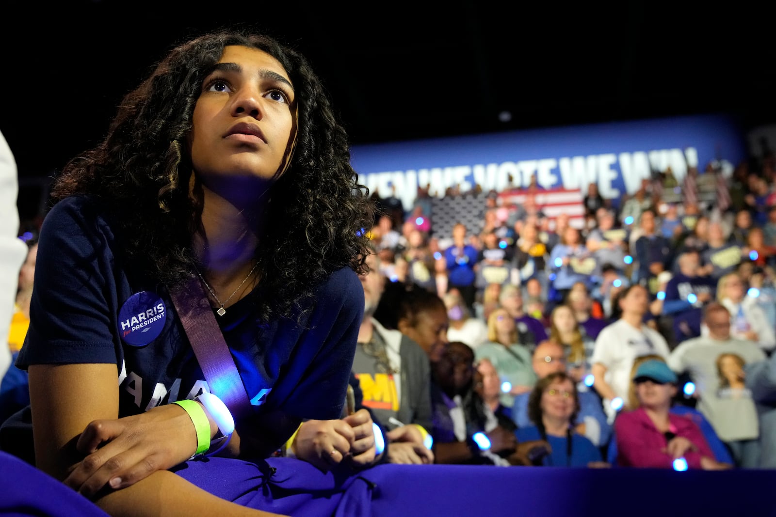 A supporter listens as former first lady Michelle Obama speaks at a campaign rally for democratic presidential nominee Vice President Kamala Harris at the Wings Event Center, in Kalamazoo, Mich., Saturday, Oct. 26, 2024.(AP Photo/Jacquelyn Martin)