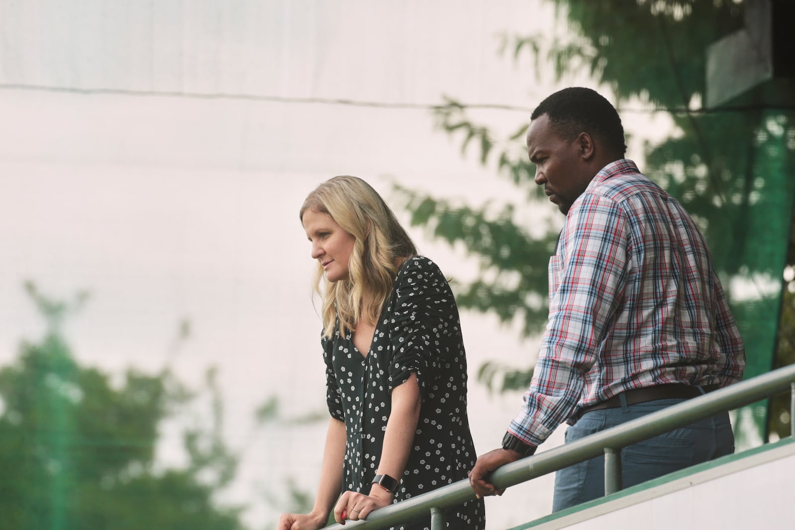 Zimbabwe Sports Minister Kirsty Coventry, left, and Zimbabwe Cricket Director Hamilton Masakadza follow the test cricket match between Zimbabwe and Sri Lanka at Harare Sports Club, in Harare, Thursday, Jan. 30, 2020. (AP Photo/Tsvangirayi Mukwazhi)