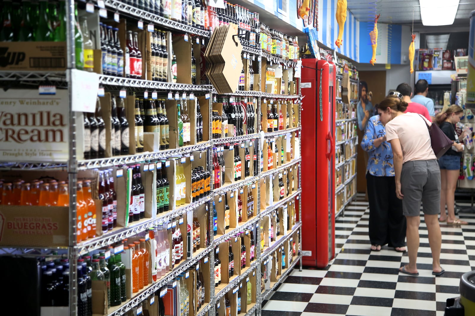 One wall of Grandpa Joe's Candy Shop is dedicated to 250 types of glass bottle sodas, among them 35 different root beers.  LISA POWELL / STAFF