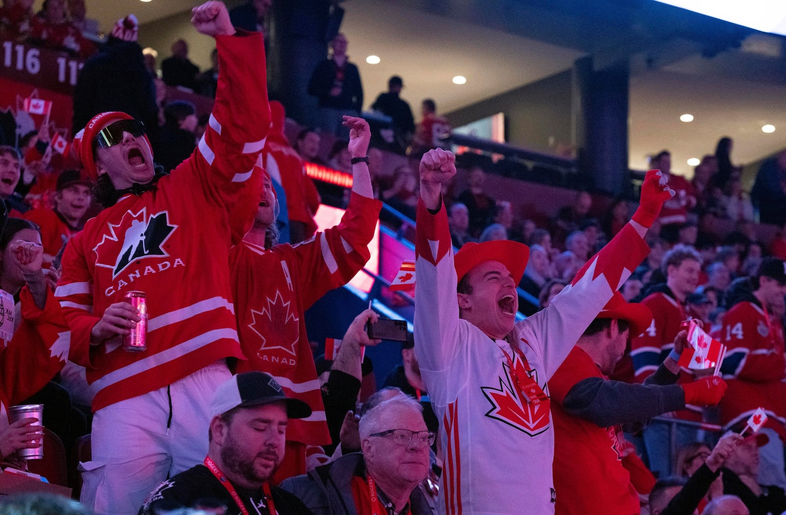 Fans cheer as Canada warms up prior to the first period 4 Nations Face-Off hockey game against the United States in Montreal on Saturday, Feb. 15, 2025. (Christinne Muschi/The Canadian Press via AP)