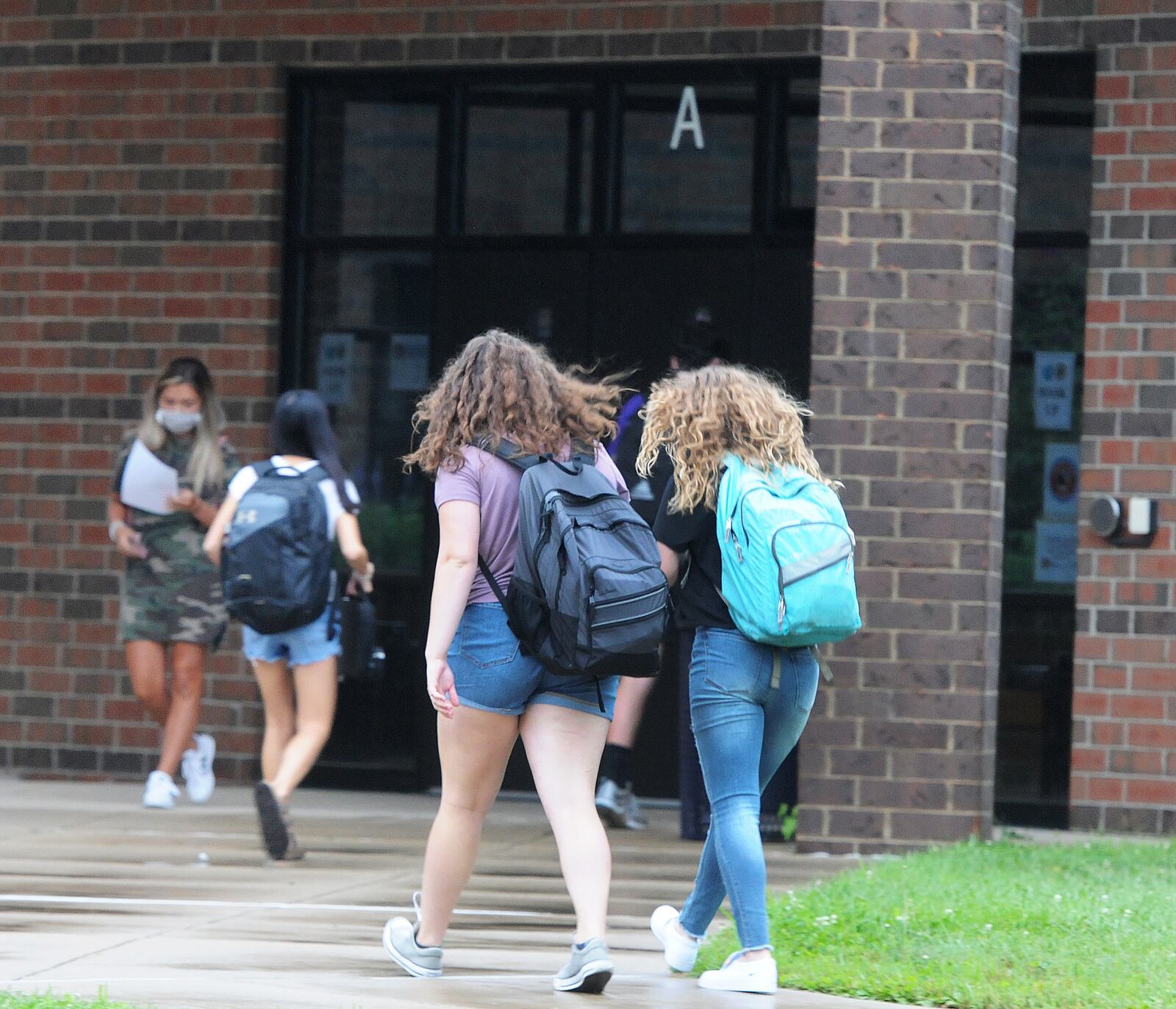 Students head to Bellbrook High School for the first day of classes in fall 2020. MARSHALL GORBY\STAFF