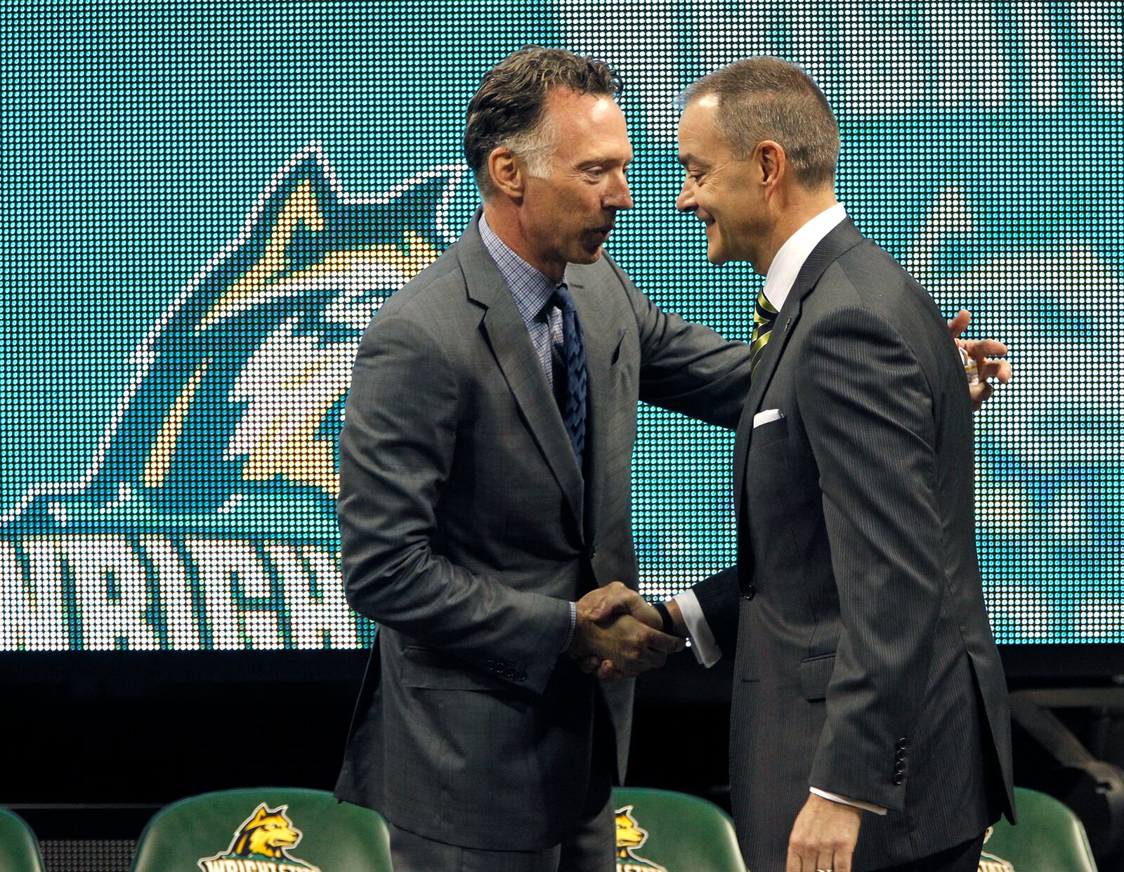 Wright State University Athletics Director Bob Grant (left) introduces Scott Nagy, the new WSU head men's basketball coach during a press conference Tuesday. Nagy, formerly of South Dakota State, is the ninth head coach in the history of the Raiders men's basketball program. LISA POWELL/STAFF