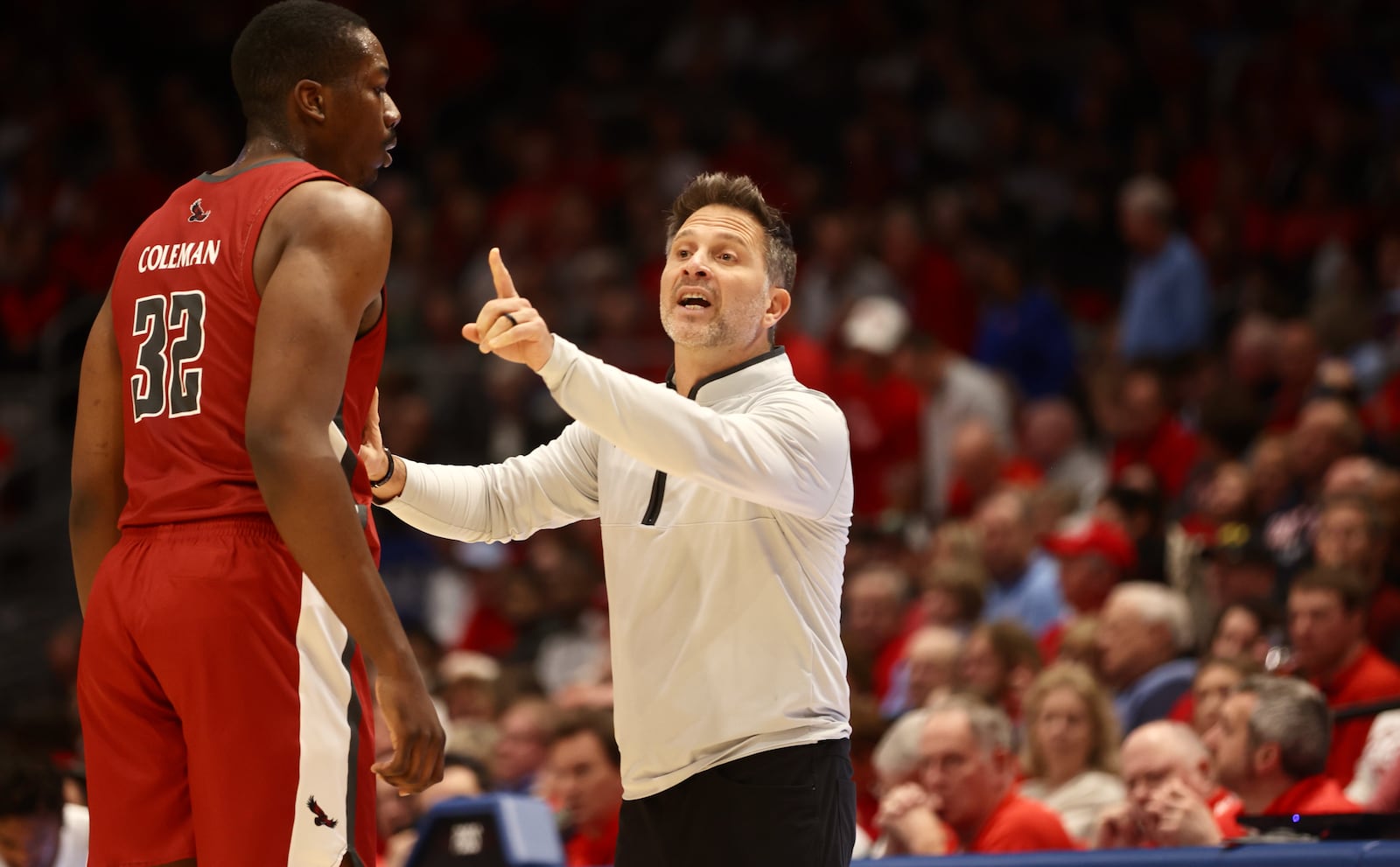 Billy Lange, of Saint Joseph’s, coaches during a game against Dayton on Wednesday, Jan. 4, 2023, at UD Arena. David Jablonski/Staff