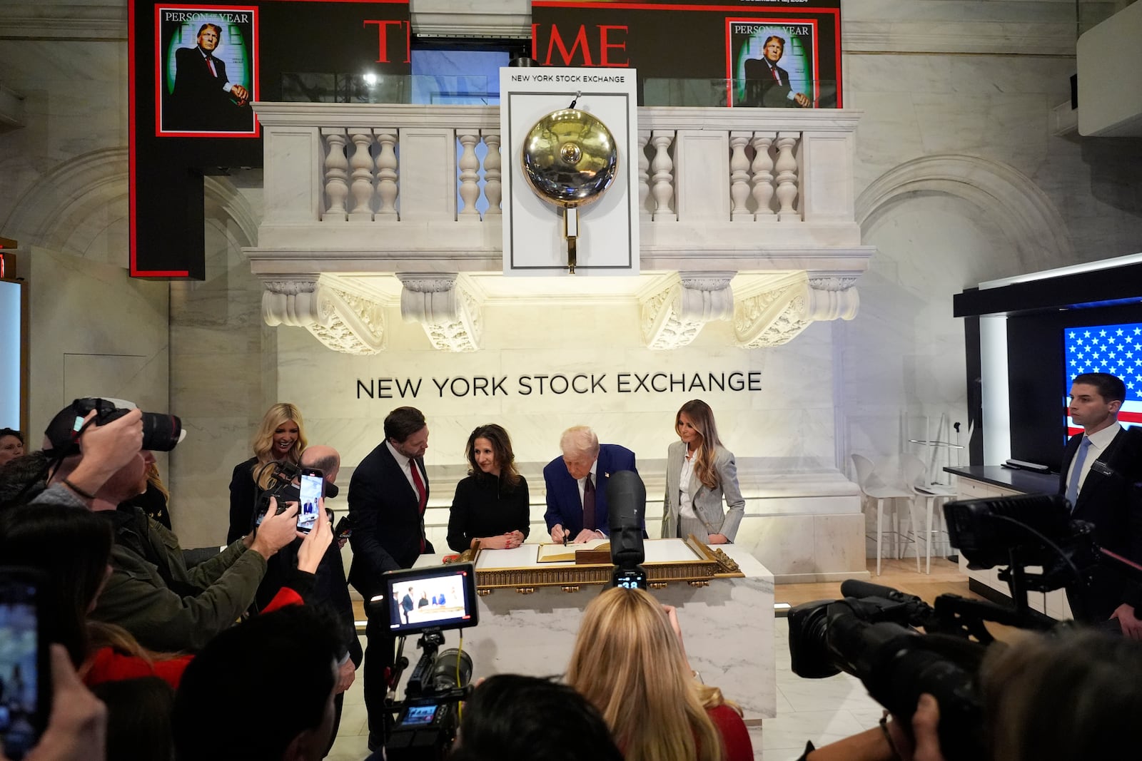 President-elect Donald Trump signs a guest book after ringing the opening bell at the New York Stock Exchange, Thursday, Dec. 12, 2024, in New York. (AP Photo/Alex Brandon)