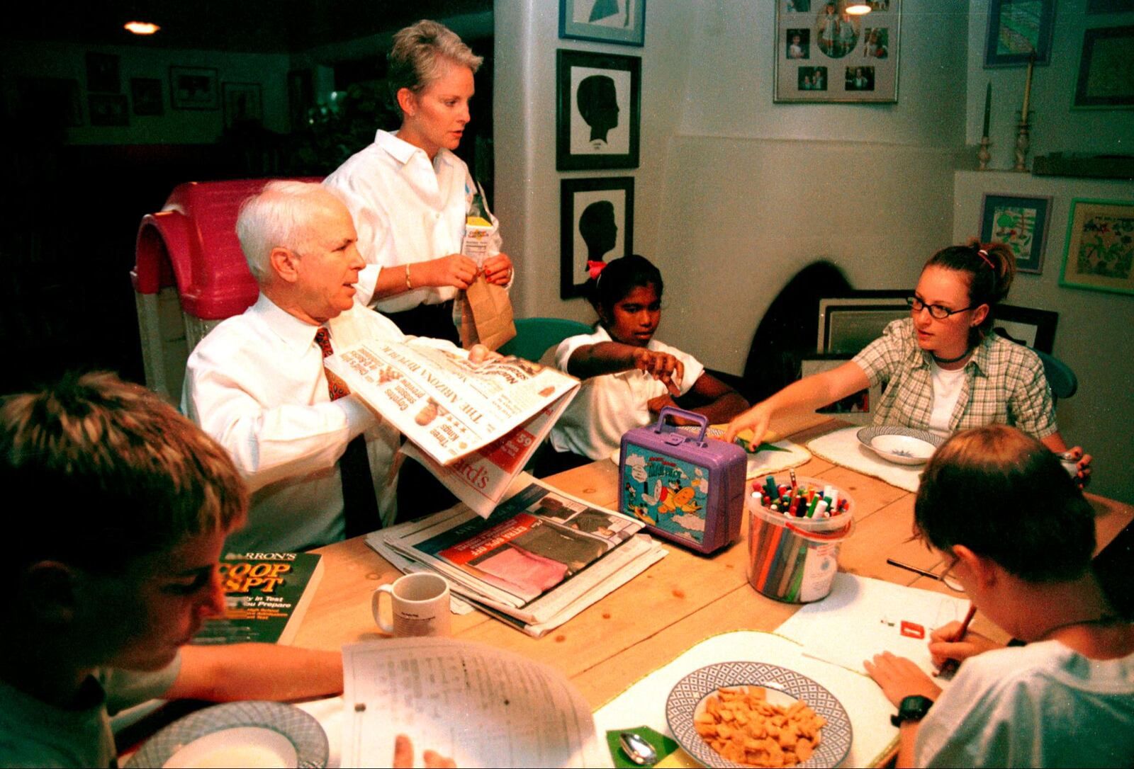 Then-presidential candidate John McCain with wife Cindy in their home in Phoenix, Arizona with their children. The oldest daughter is Meghan, their adopted daughter is Bridgette and their two sons Jack and Jimmy are seated at the table on October 14, 1999.