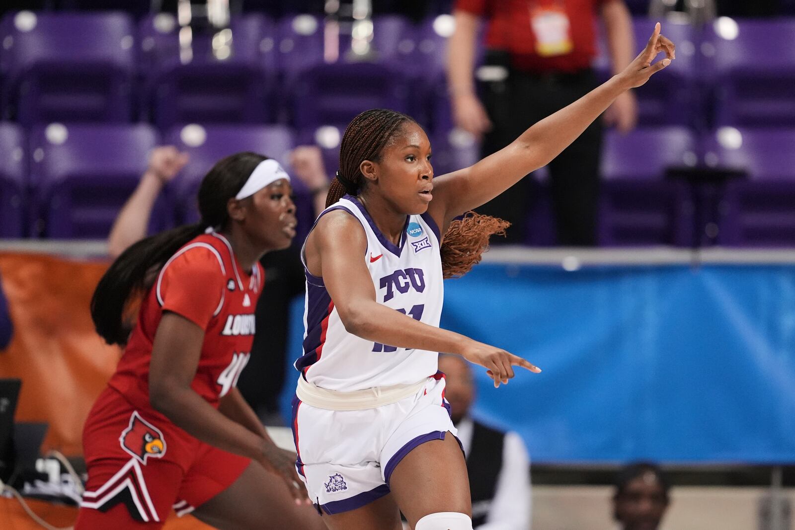 TCU guard Agnes Emma-Nnopu celebrates after sinking a three-pointer against Louisville in the first half in the second round of the NCAA college basketball tournament in Fort Worth, Texas, Sunday, March 23, 2025. (AP Photo/Tony Gutierrez)