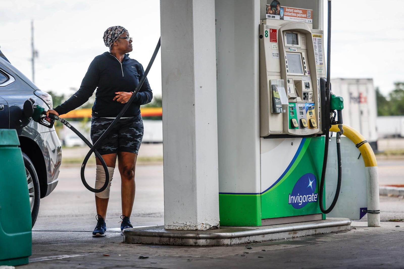 Maxine White fills up her tank at the BP at Edwin C. Moses Boulevard and Interstate 75 Tuesday Aug. 30, 2022. Fuel prices have dropped for 11 consecutive weeks but experts say there could be a temporary bump in the road ahead. JIM NOELKER/STAFF