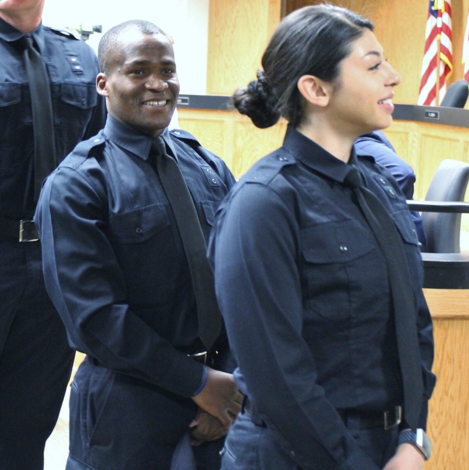 Ndayisaba Ramadhan (left) was one of several people sworn in Friday as Dayton police officers. Cara Zinski-Neace/CONTRIBUTED