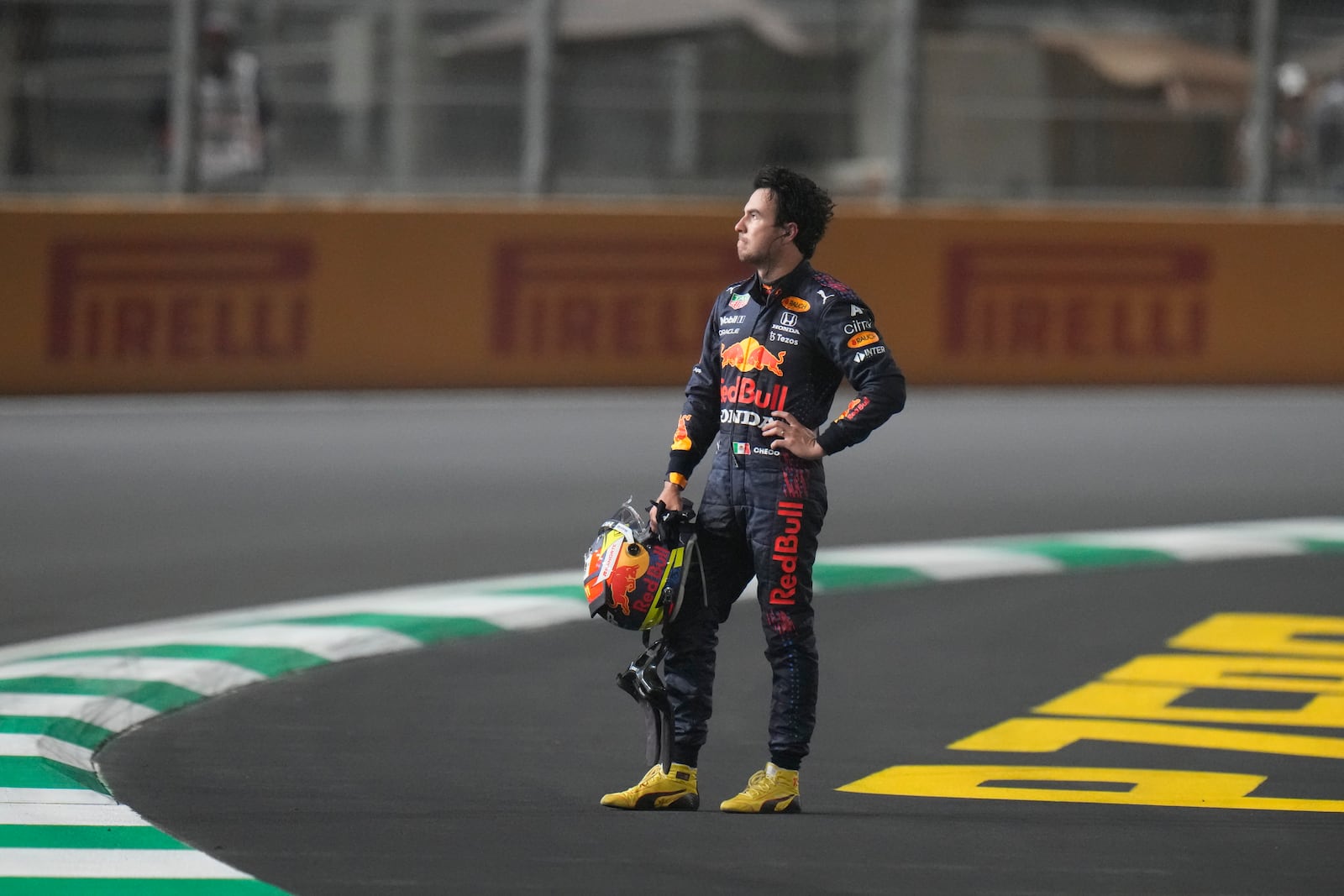 FILE - Red Bull driver Sergio Perez of Mexico waits for the safety car after race was stopped during the Formula One Saudi Arabian Grand Prix in Jiddah, Sunday, Dec. 5, 2021. (AP Photo/Hassan Ammar, File)