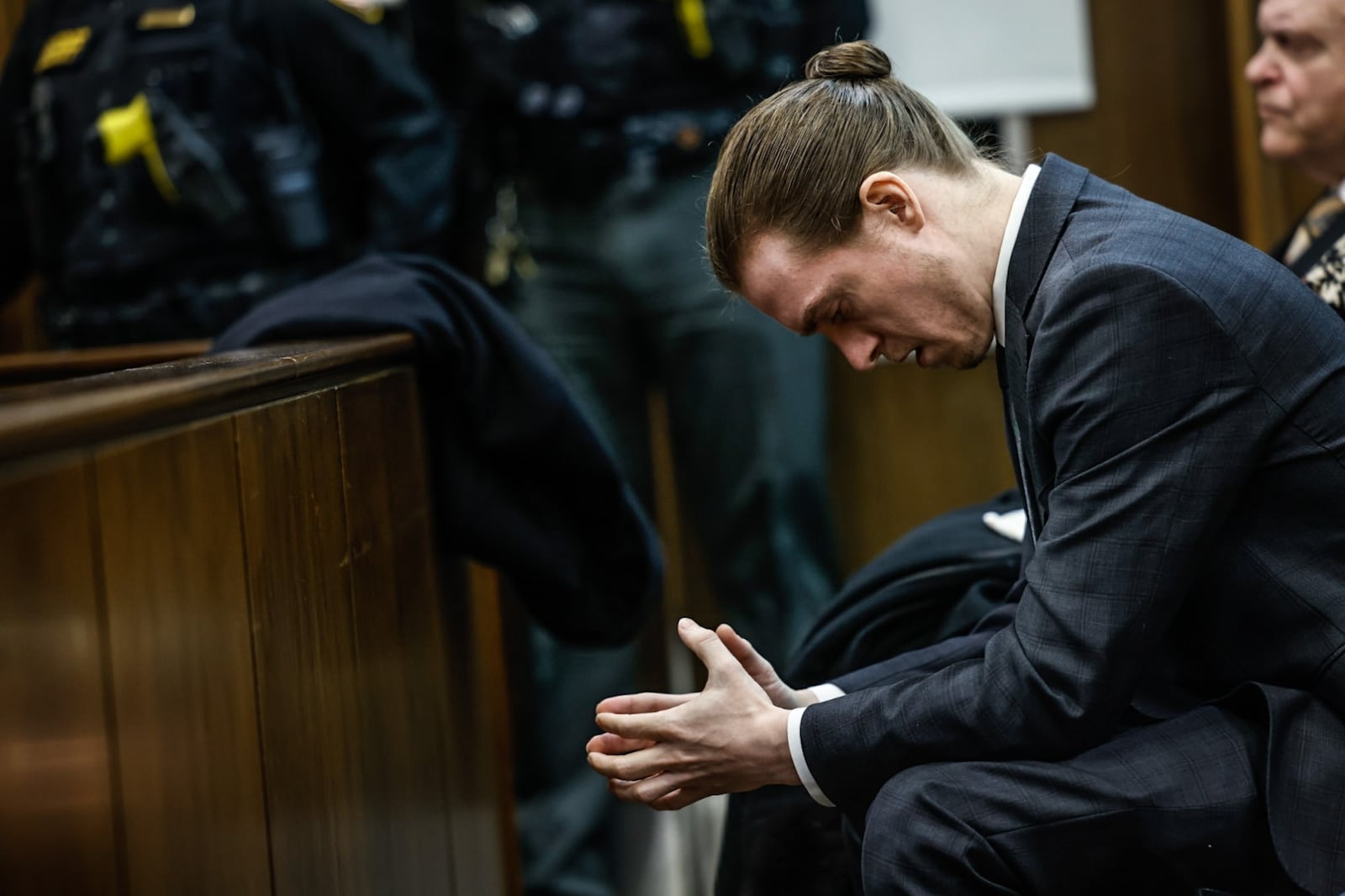 Andrew Ball waits in Judge Daniel Hogan's courtroom for the sentencing of John Amos Friday morning at the Montgomery County Common Pleas Court. JIM NOELKER/STAFF