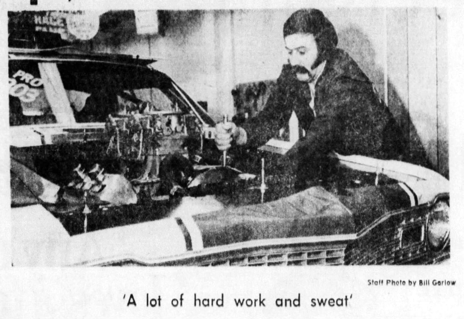 William Elias "Bill" Stepp works on one of his cars in 1974. DAYTON DAILY NEWS ARCHIVES