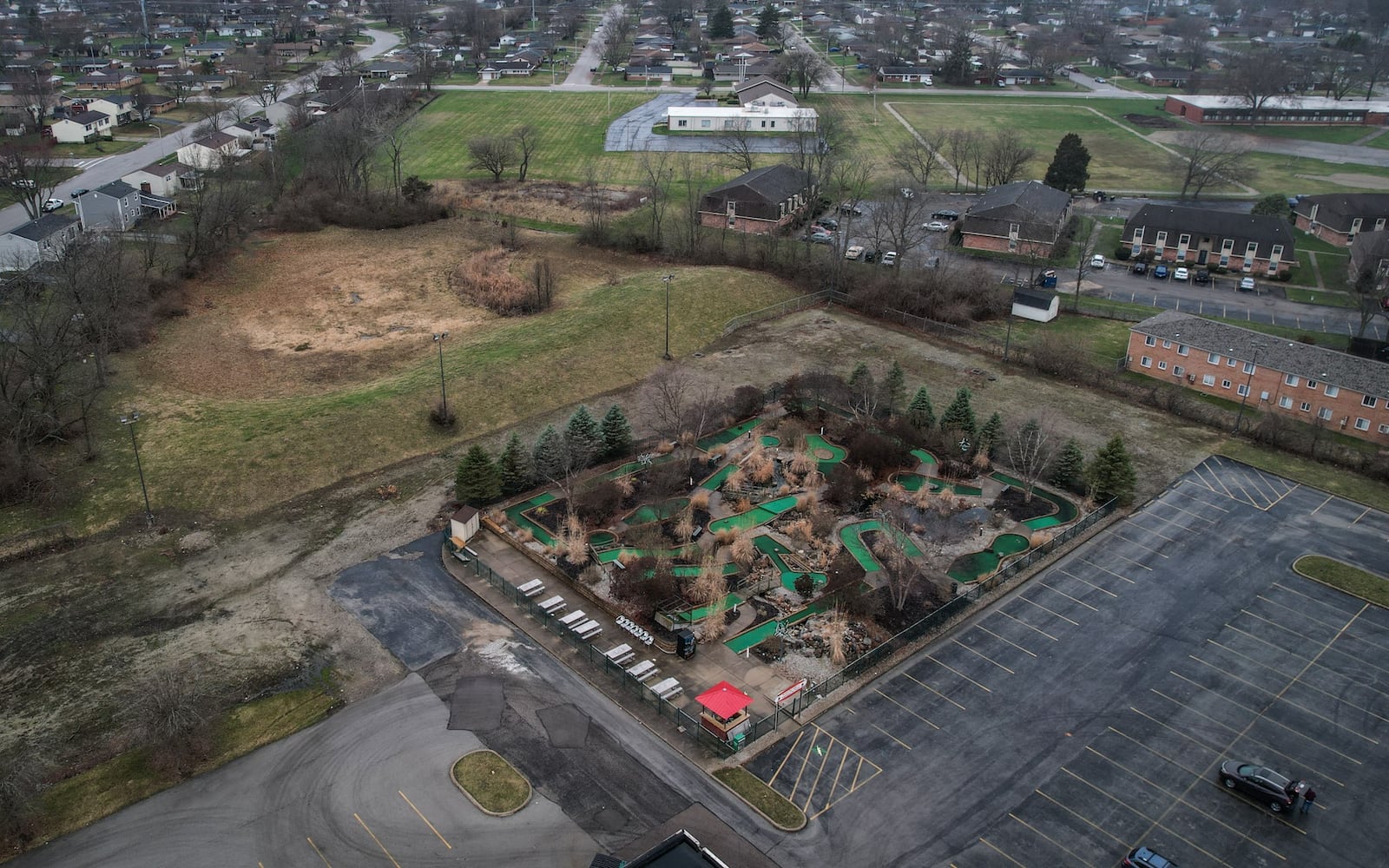 The Englewood Fun Center on South Main in Englewood wants to build a go kart track around their mini-golf area. This aerial shows the mini-golf, in the center, surrounded by vacant land, apartments and houses. JIM NOELKER/STAFF