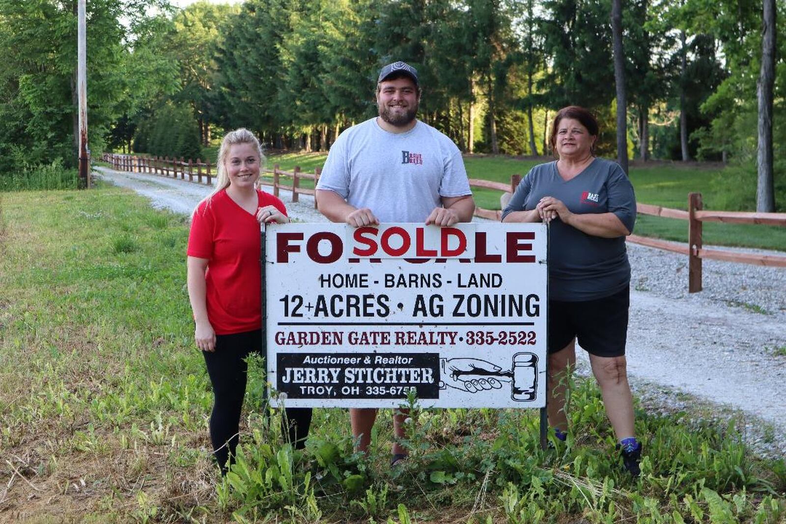 From left: Bailey Martin, Wes Martin and Rhonda Martin (Wes s mom) celebrate the purchase of an old winery on 12.5 acres outside West Milton that will be home to Brave Breed Rescue. CONTRIBUTED