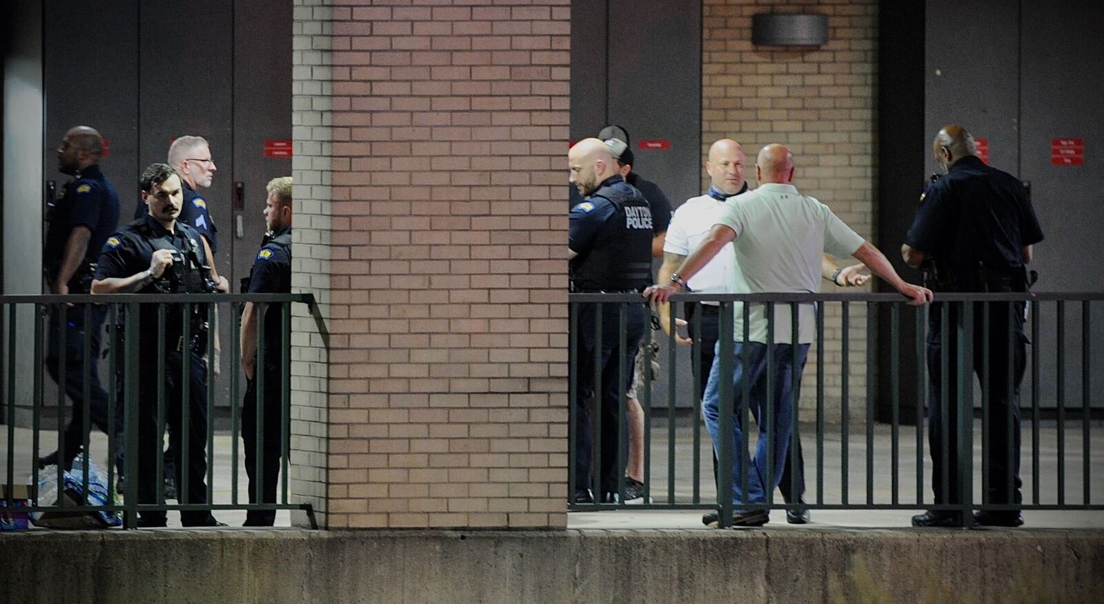 Police waiting outside emergency room doors at Miami Valley Hospital. MARSHALL GORBY\STAFF