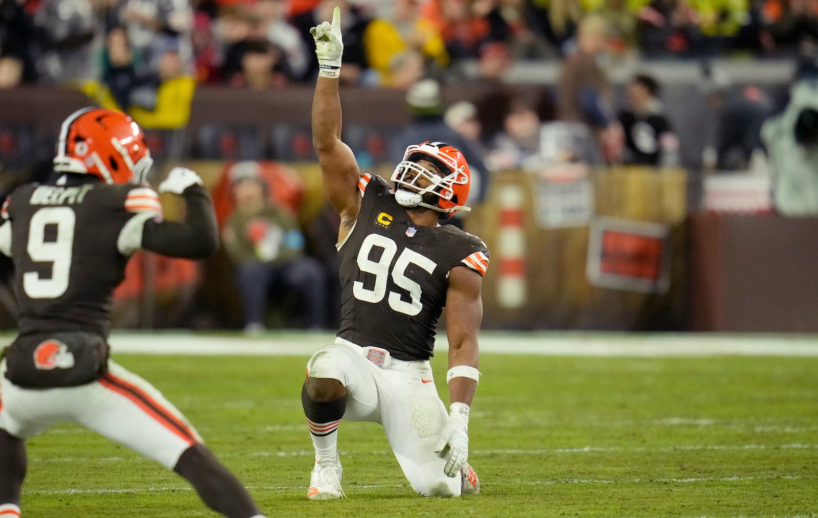 Cleveland Browns defensive end Myles Garrett (95) celebrates after sacking Miami Dolphins quarterback Tyler Huntley during the second half of an NFL football game Sunday, Dec. 29, 2024, in Cleveland. (AP Photo/Sue Ogrocki)