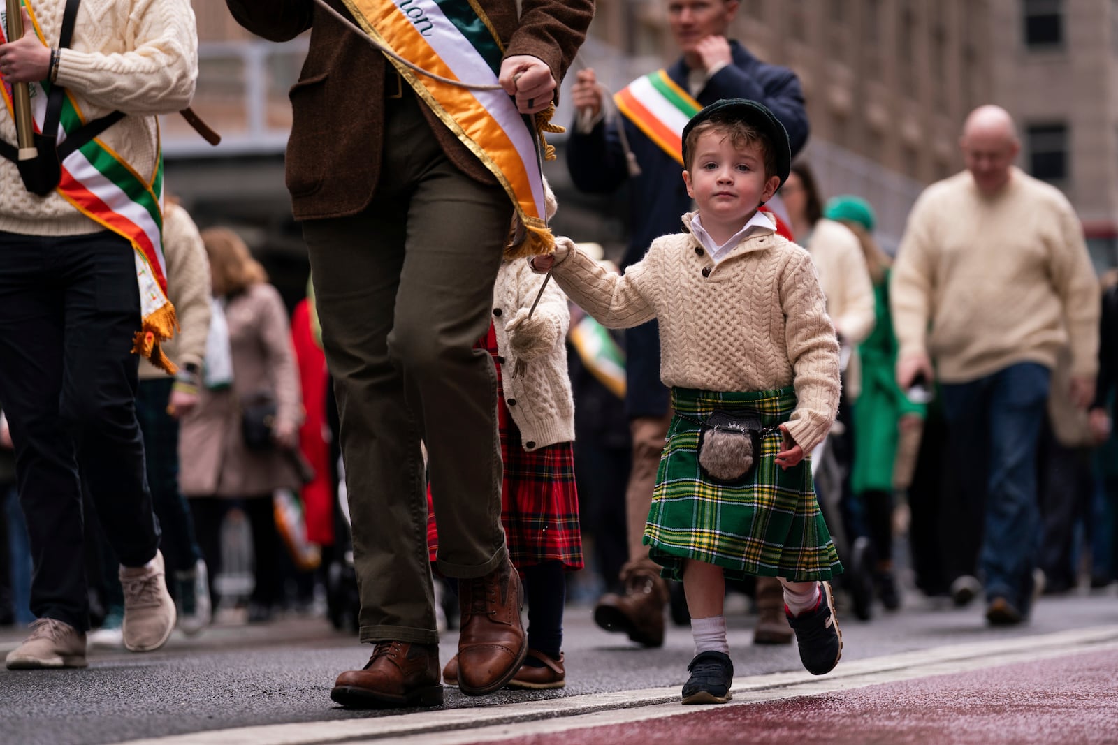 A child marches in the 264th New York City Saint Patrick's Day Parade, Monday, March 17, 2025 in New York. (AP Photo/Adam Gray)