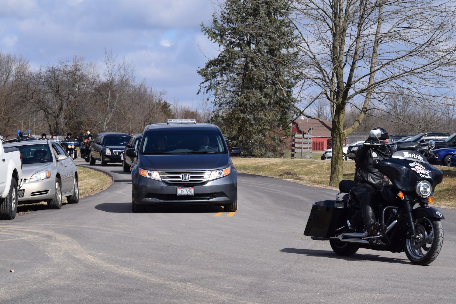 PHOTOS: Thousands of Outlaws attend motorcycle gang leaders funeral at Montgomery County Fairgrounds.