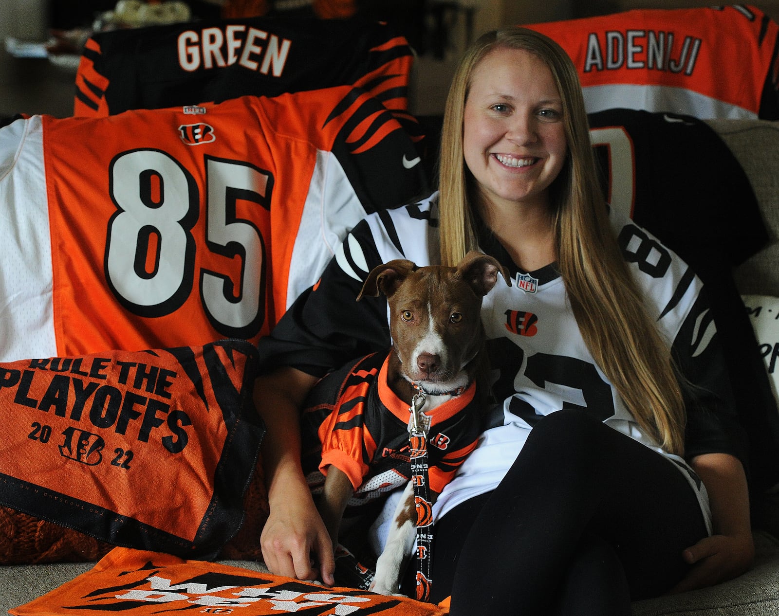 Cincinnati Bengals fan Sydney Cannada with her dog Cincy at her home. MARSHALL GORBY\STAFF 