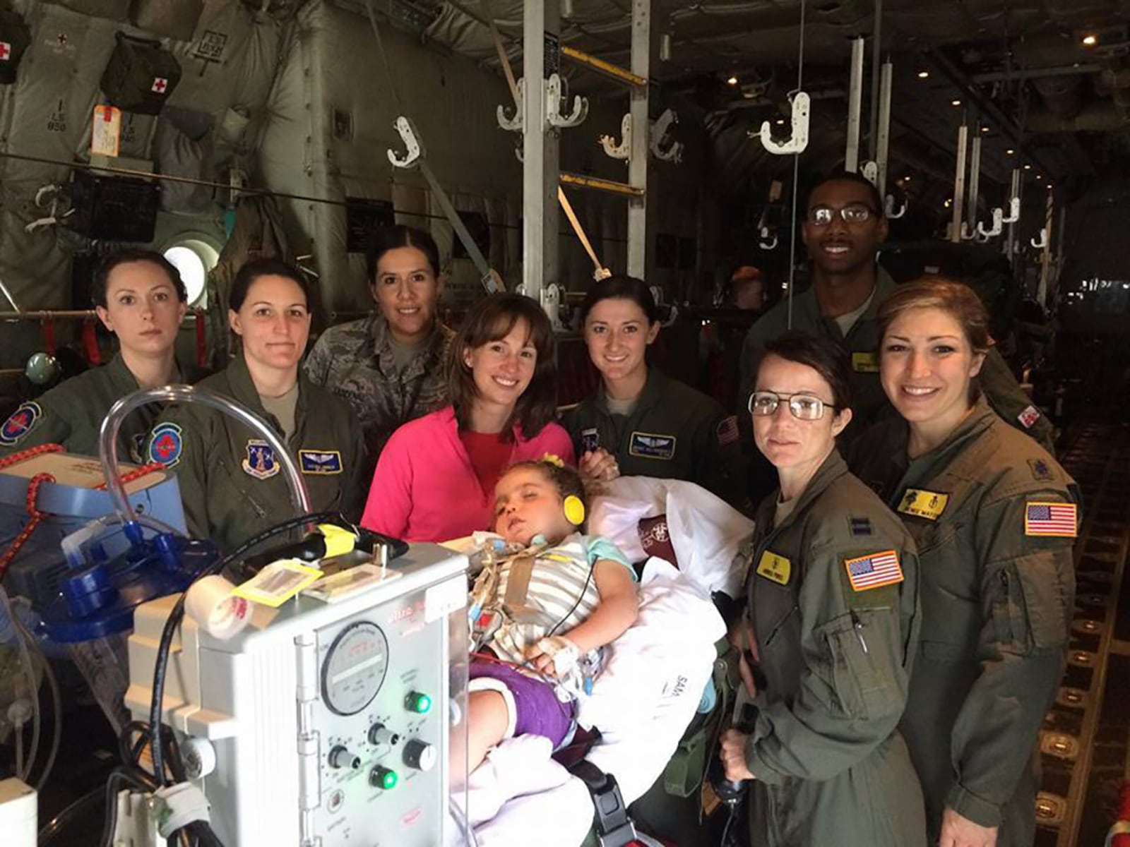 Tawny Shaffer and her daughter, Teagan, are pictured with an Air Force medevac crew. Teagan has faced years of hospitalizations and surgeries after being born with a congenital diaphragmatic hernia and then contracting a life-threatening respiratory virus. CONTRIBUTED PHOTO