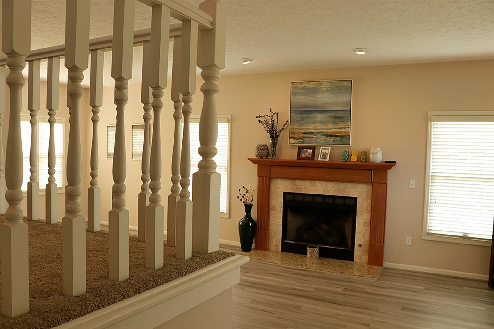 Off the foyer to the right, the centerpiece to the living room is a gas fireplace with fluted wood mantel and marble hearth. Windows fill the room with plenty of natural light. CONTRIBUTED PHOTO BY KATHY TYLER