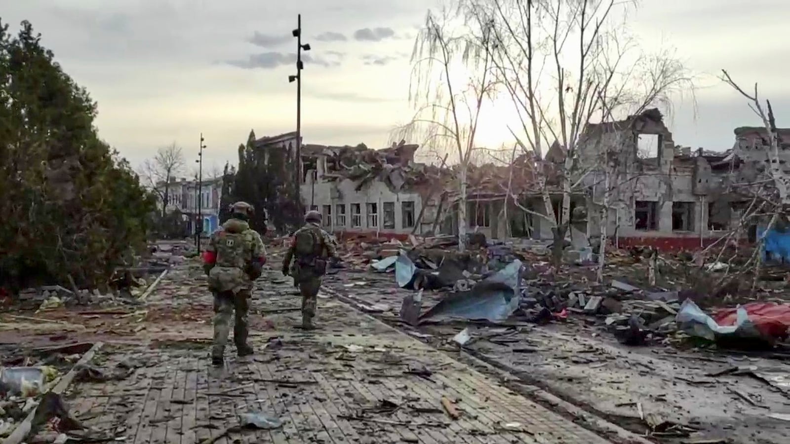 In this photo taken from video distributed by Russian Defense Ministry Press Service on Thursday, March 13, 2025, Russian soldiers patrol an area in Sudzha, the Kursk region of Russia after it was taken over by Russian troops. (Russian Defense Ministry Press Service via AP)